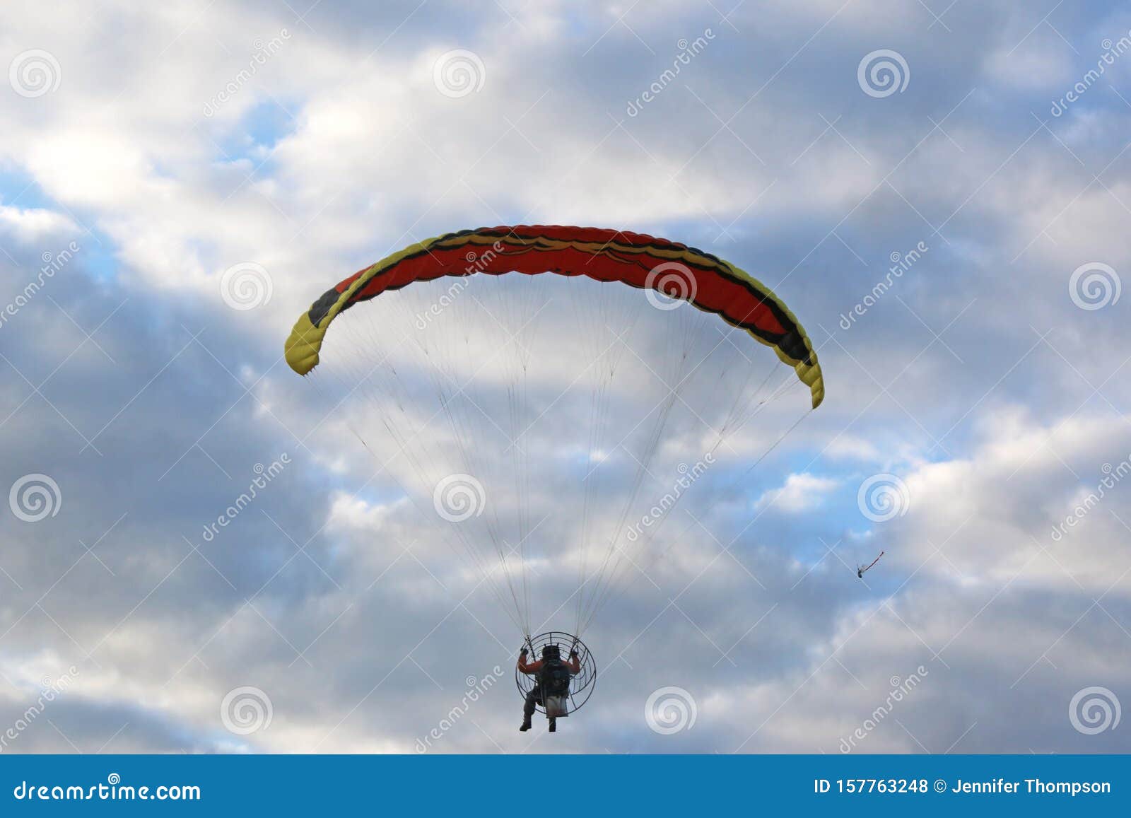 Paramotor Flying in a Blue Sky Stock Photo Image of paraglider