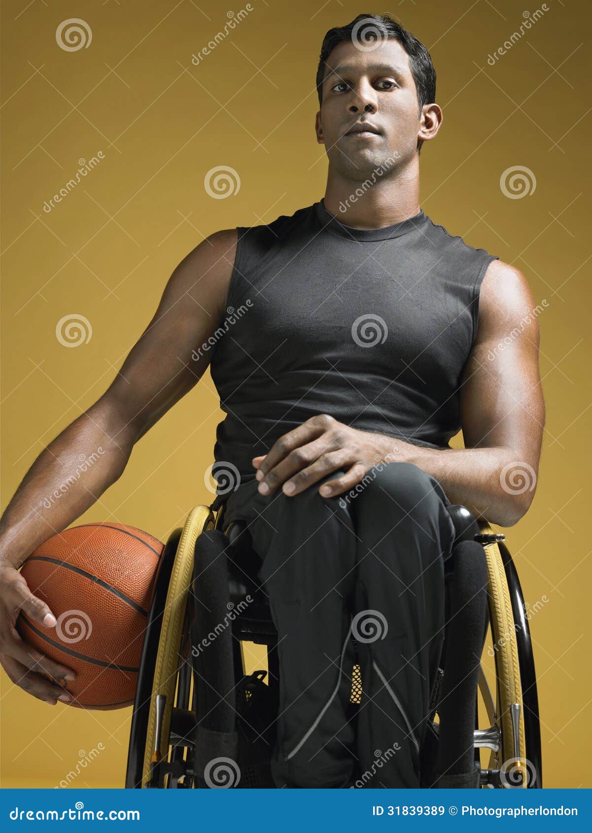 paraplegic athlete with basketball in wheelchair