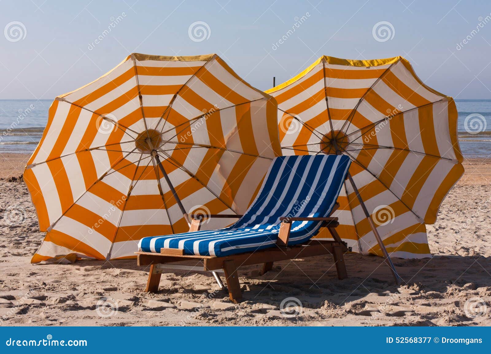 Parasols at the beach stock image. Image of relax, white 52568377