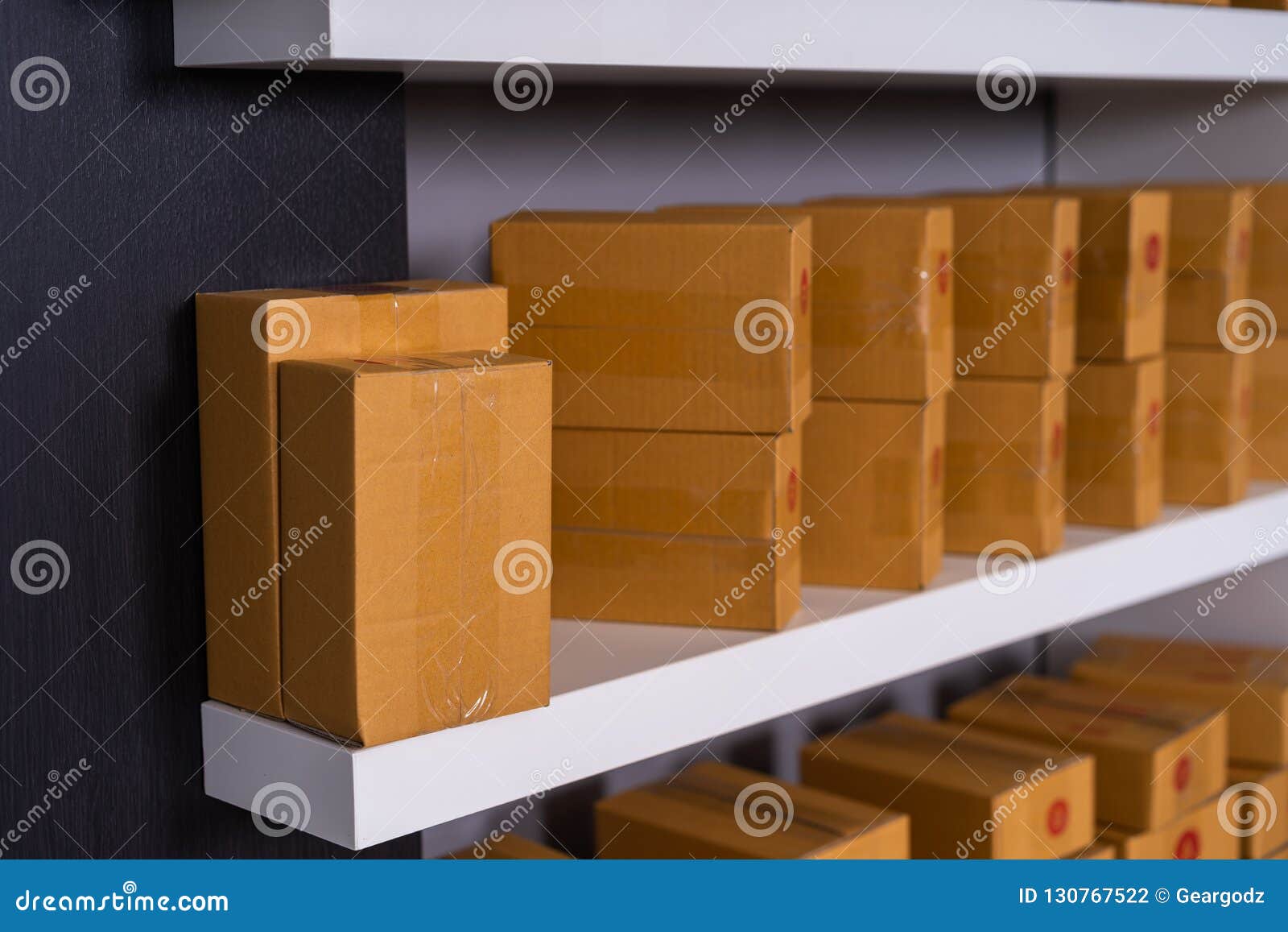 Parcels on Shelf Ready for Shipment To Client in Home Office Stock