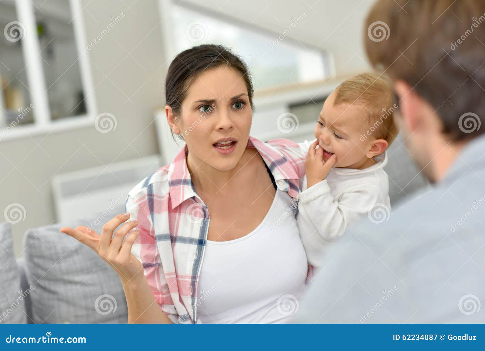 parents arguing in front of baby