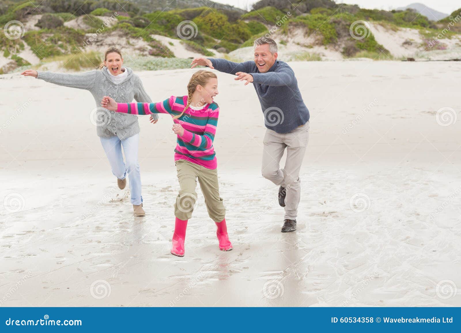 Parents Chasing Their Kid for Fun Stock Photo Image of child, mother