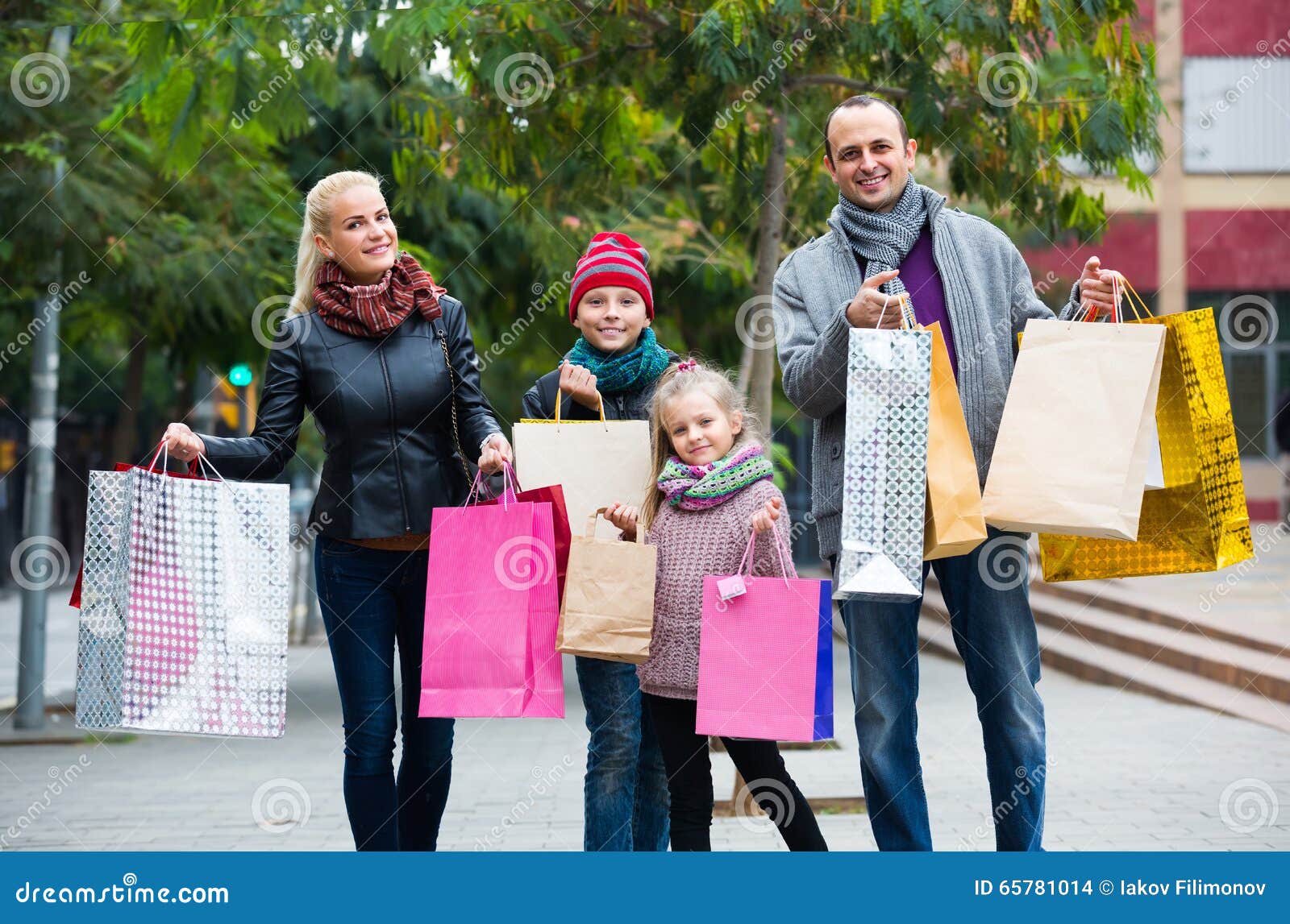 Parents With Children Shopping In City Stock Photo Image 65781014