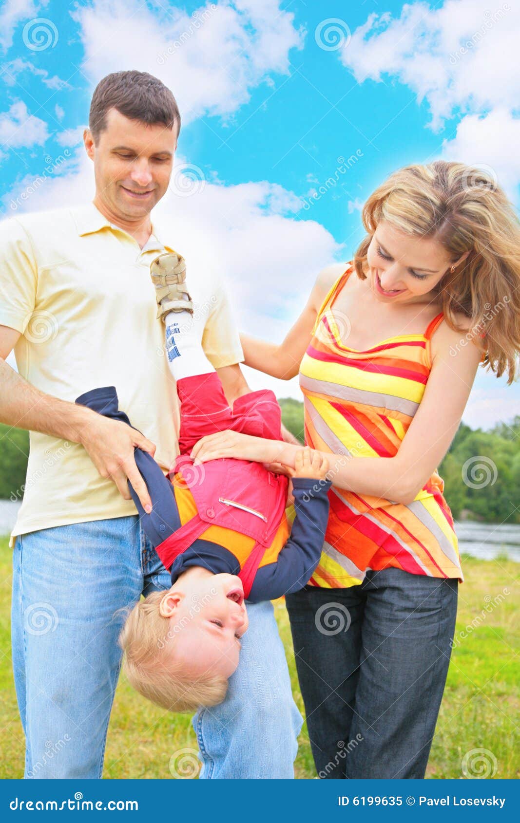 parents hold child beneath by head
