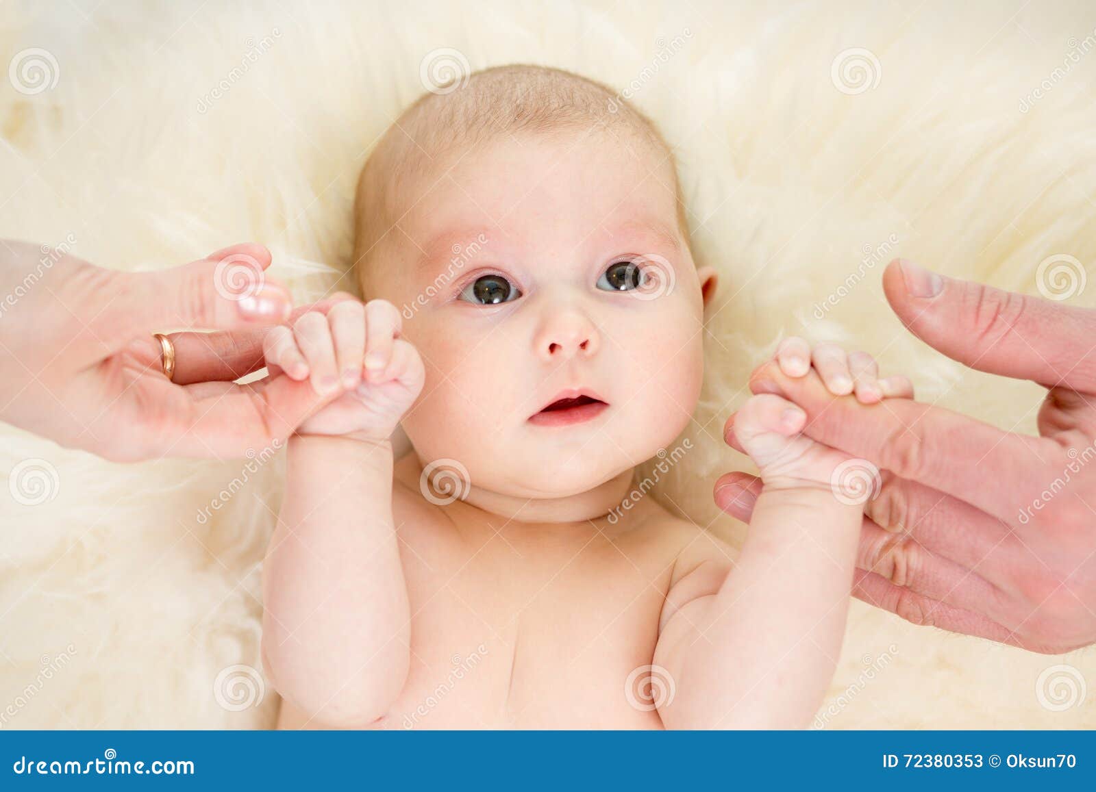 Parents Holding Baby Hands. Top View. Stock Image - Image of ...