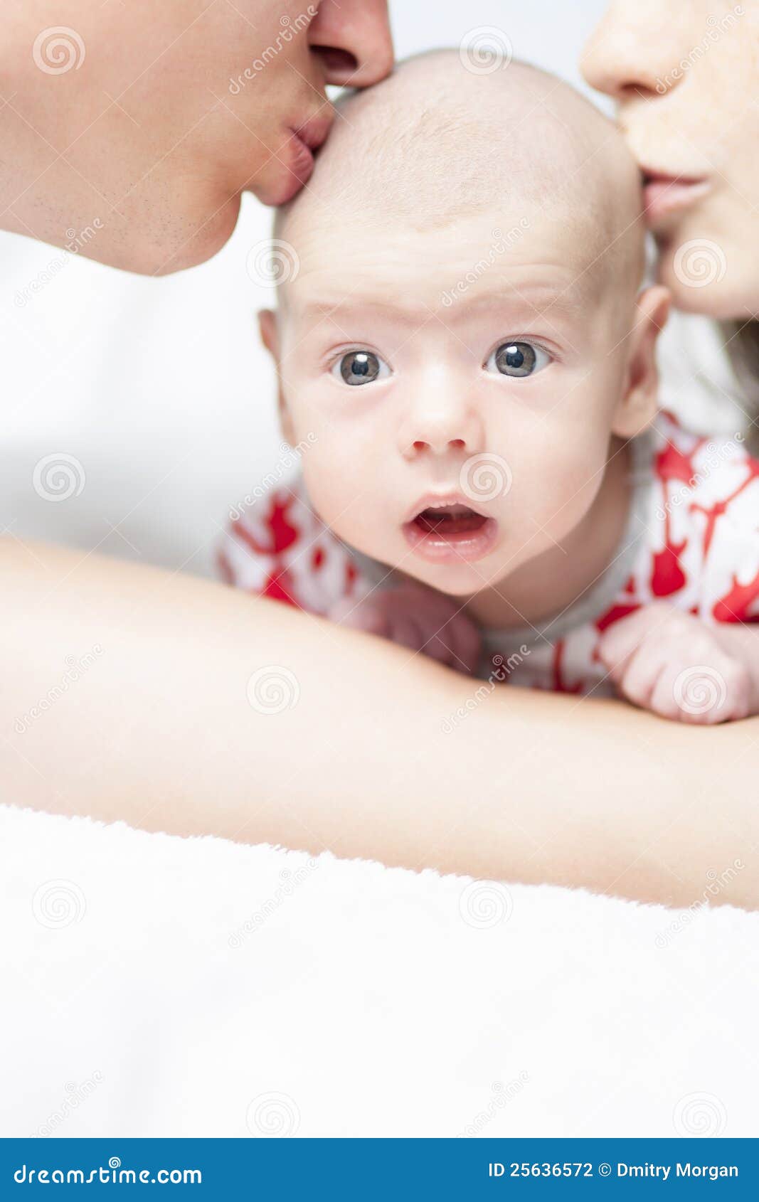 Parents Kissing Their Newborn Son Stock Photo Image of smiling