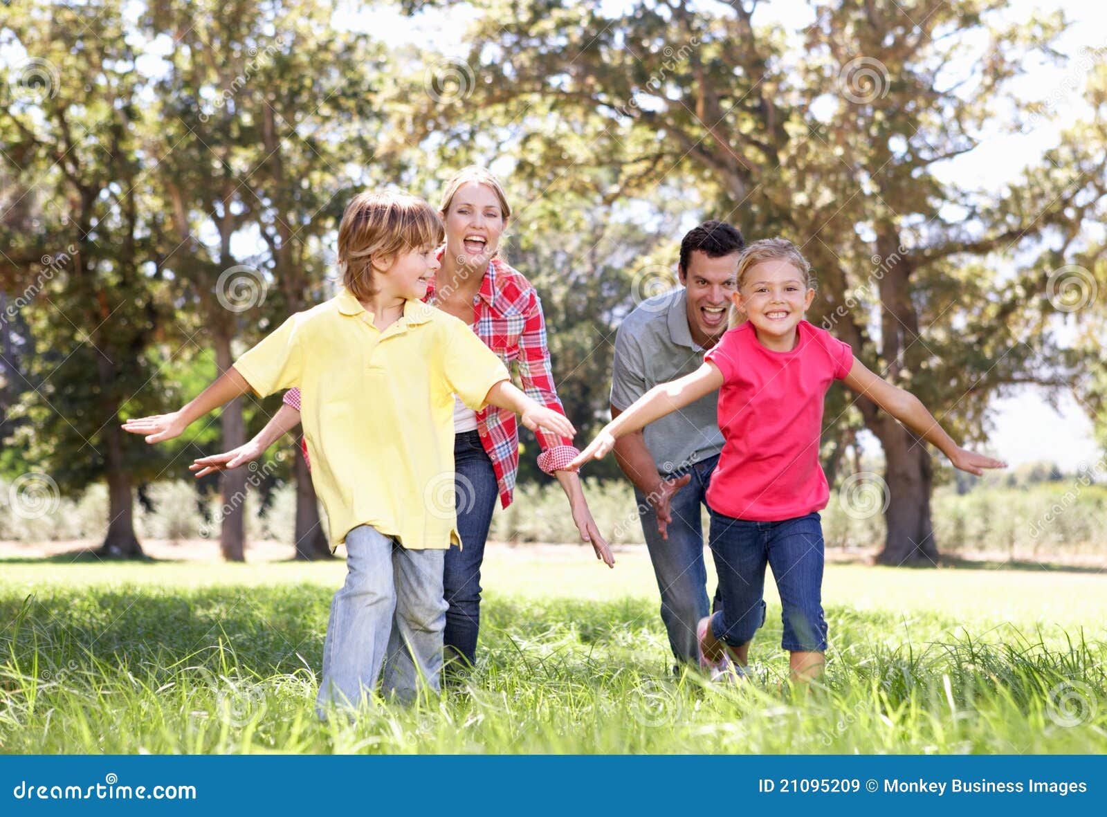 parents playing with children in country