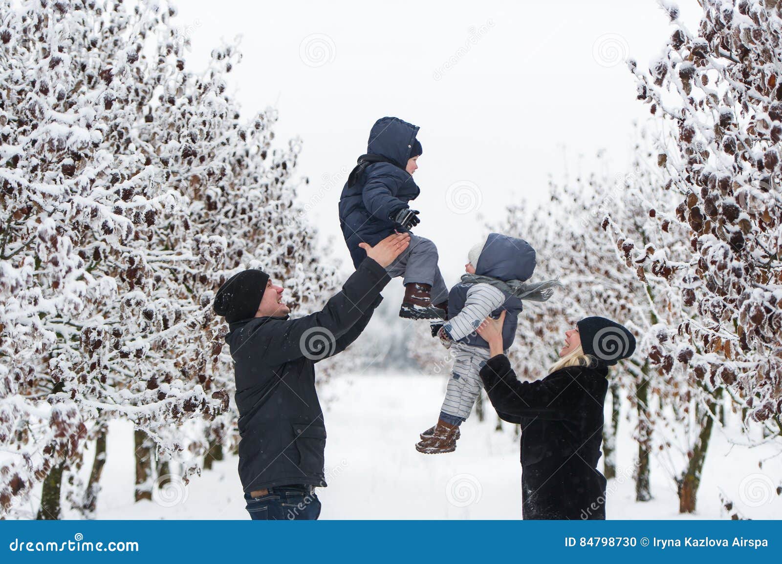 Parents throw the kids up stock photo. Image of little 84798730