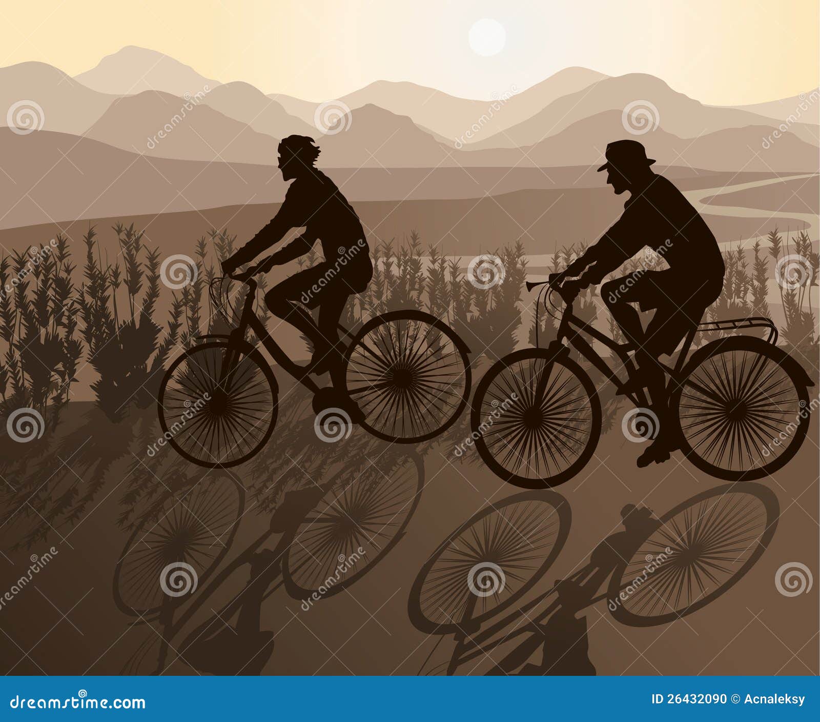 Los pares Biking contra puesta del sol