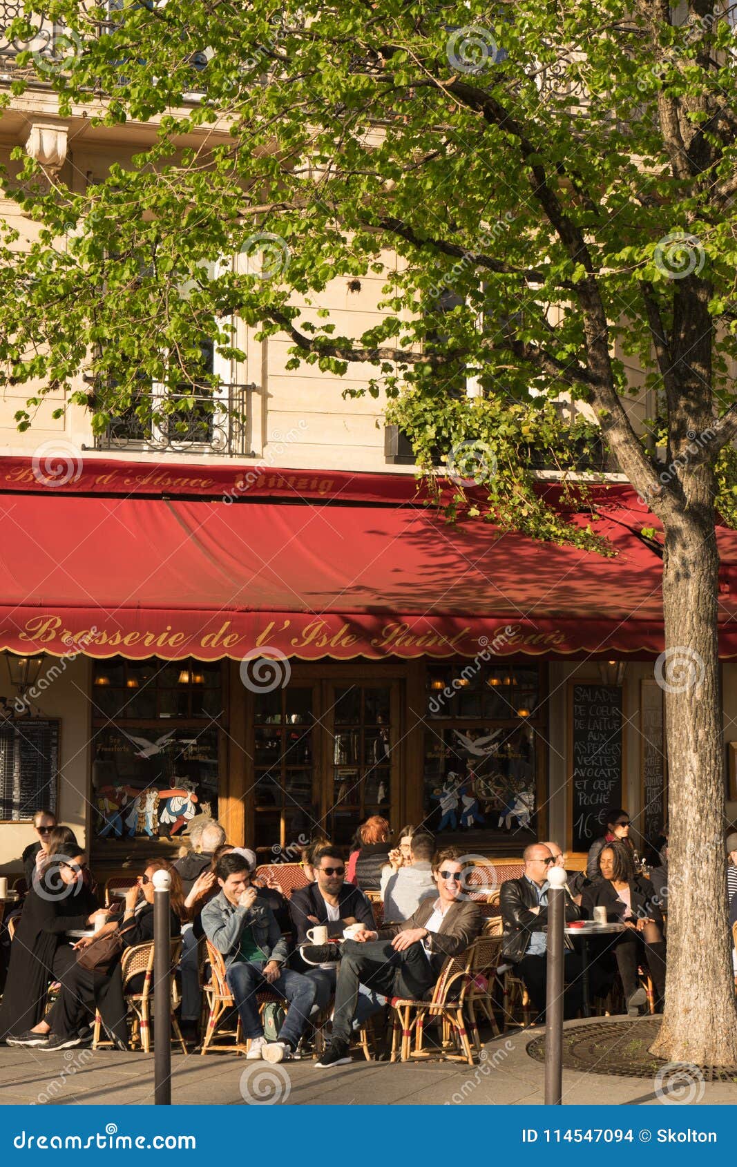 Parisians and Tourists Enjoy a Drink on a Terrace of Typical Paris ...