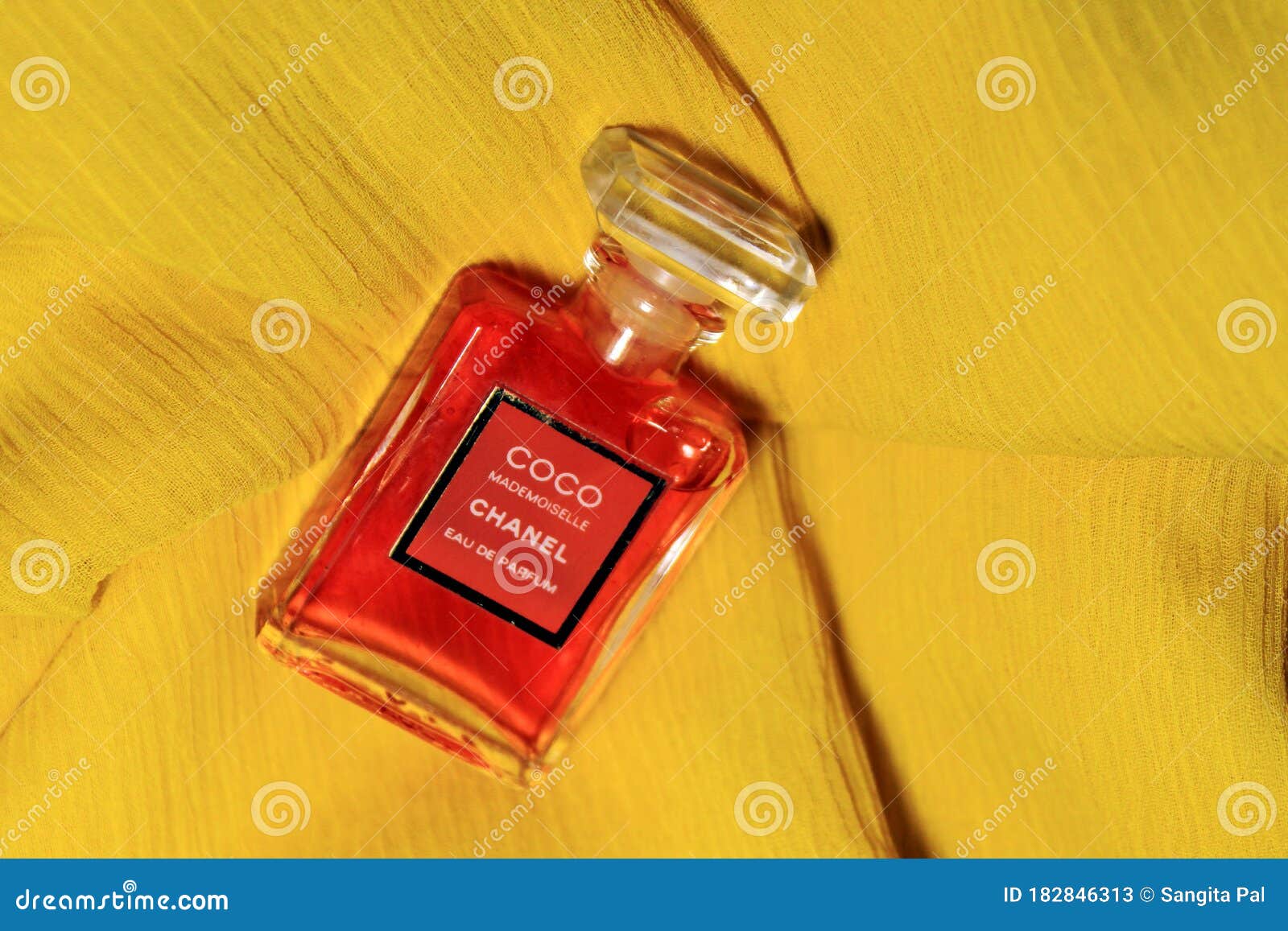 Chanel Perfume Bottles Isolated on Yellow Background. Bottles with ...