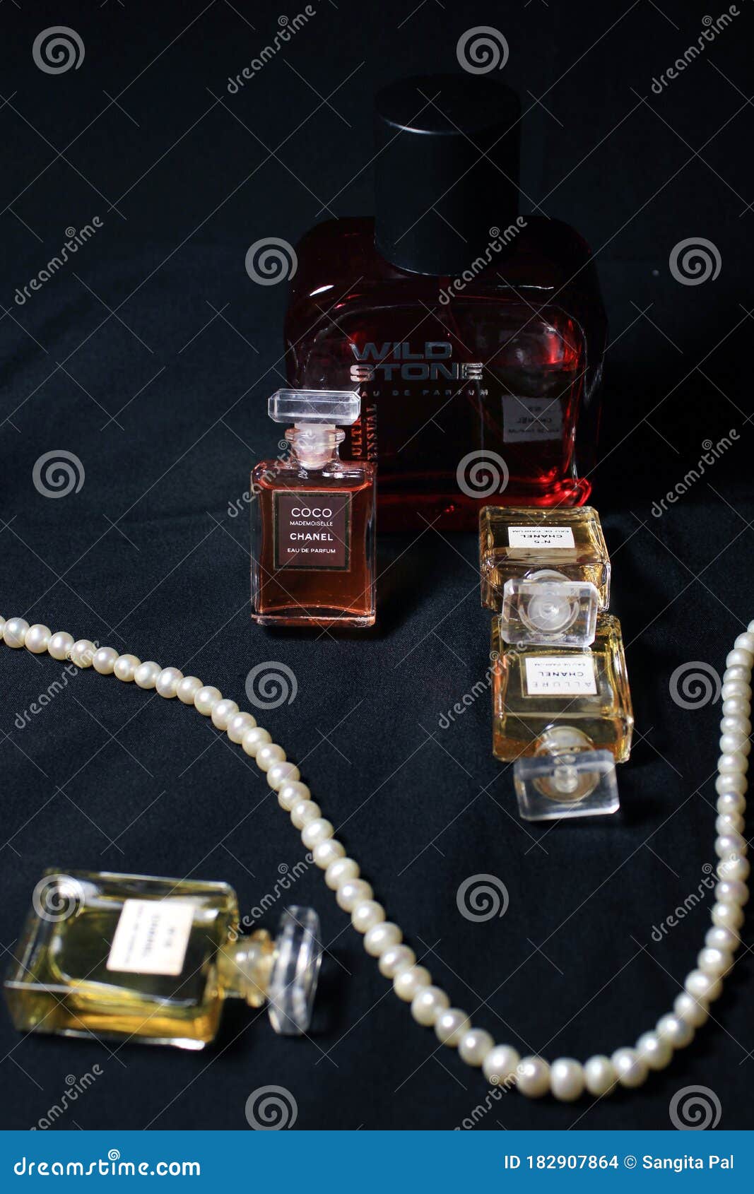 Chanel Perfume & Wild Stone Bottles Isolated on Black Background. Bottle  with Coco Chanel & N`5 Chanel Perfume Product Editorial Photo - Image of  famous, closeup: 182907946