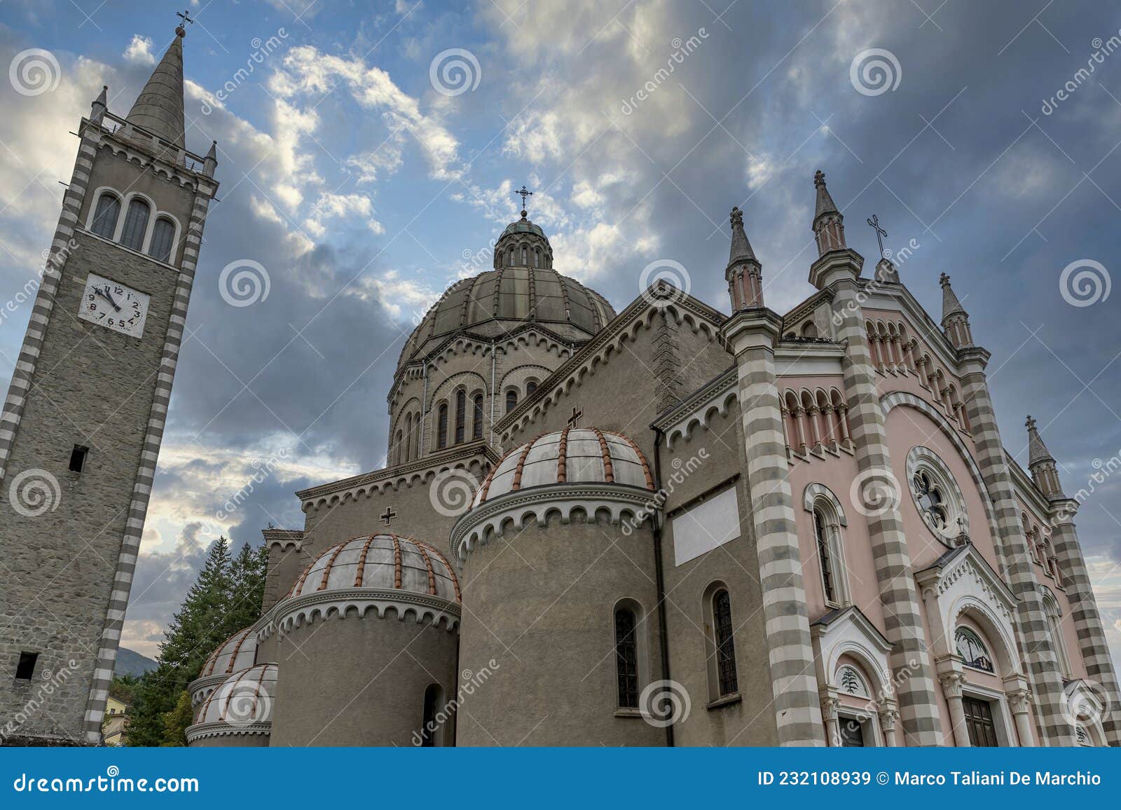 parish church of san mamante, lizzano in belvedere, italy, under a dramatic sky