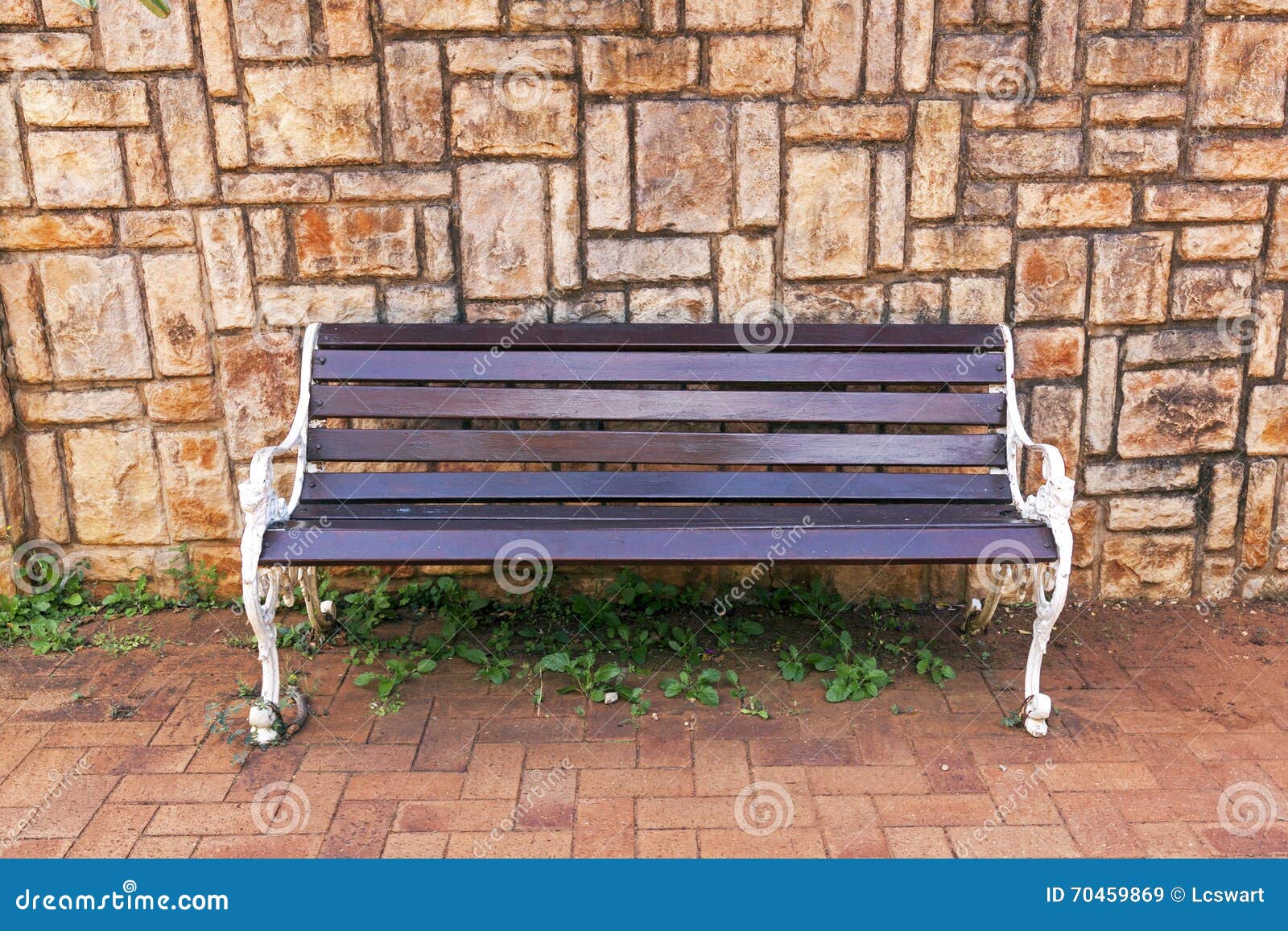 Park Bench Against Concrete Patterned Background Wall Stock Image