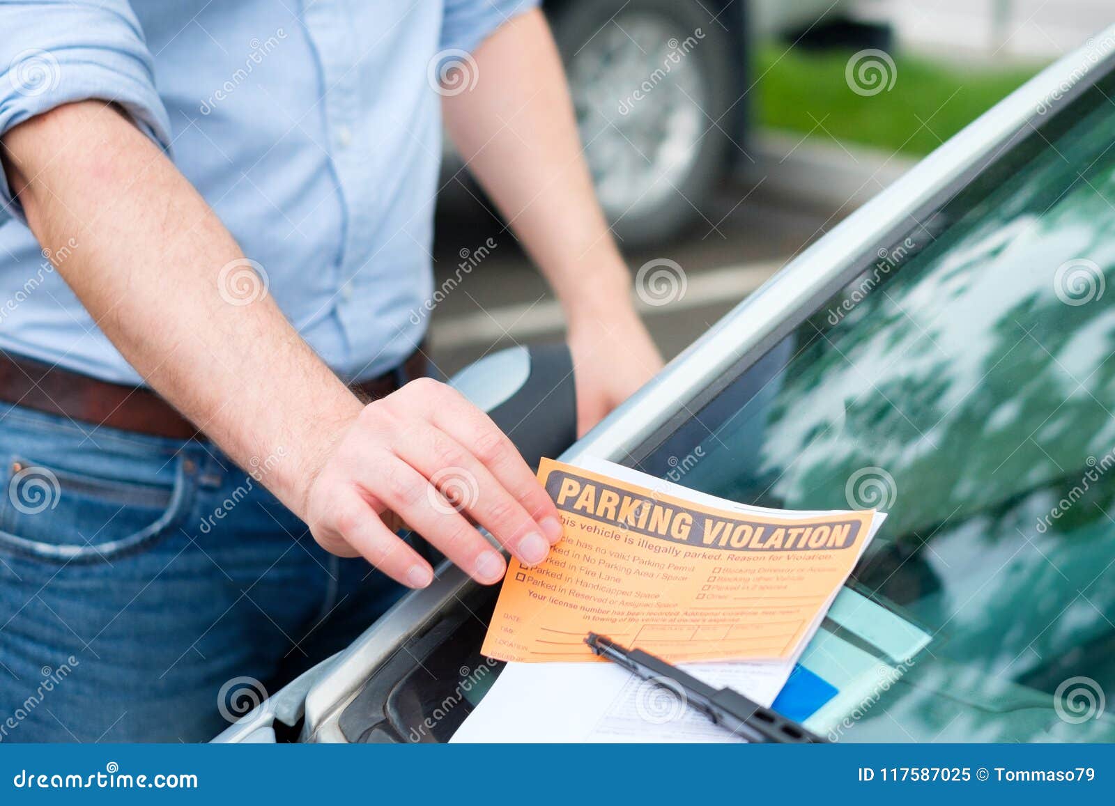 Parking Ticket Violation Notice Placed Under Windshield Wiper Stock