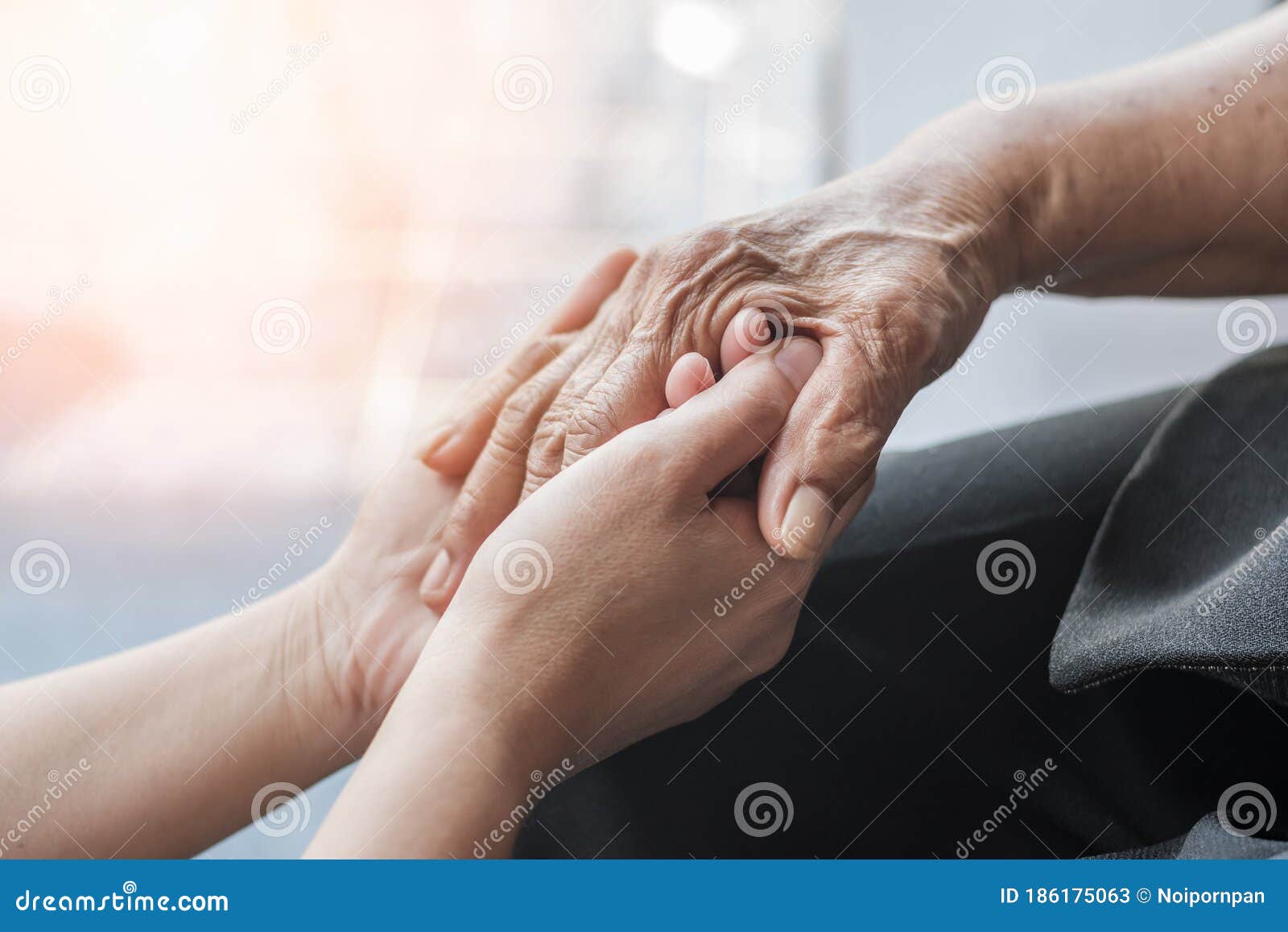parkinson disease patient, alzheimer elderly senior, arthritis person hand in support of nursing family caregiver care