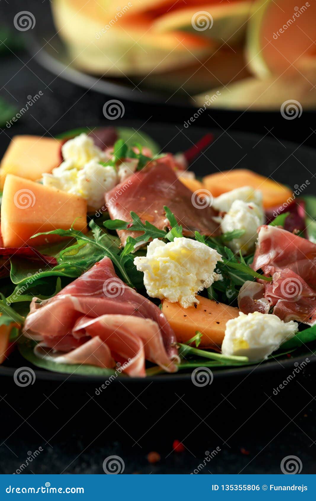Parma Ham and Melon Salad with Mozzarella, Green Leaves Mix Stock Photo