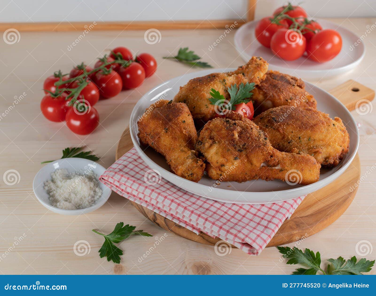 Parmesan Breaded Chicken Drumsticks and Shanks on a Platter Stock Photo