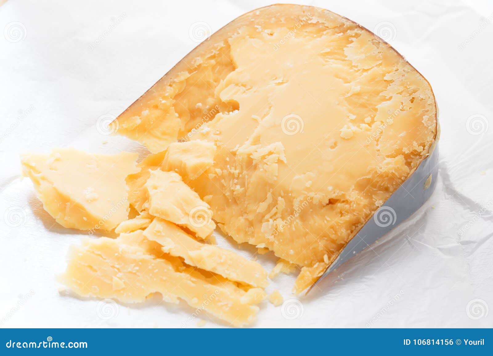 Parmesan Cheese on a Piece of Paper Wrapping. Stock Photo Image of