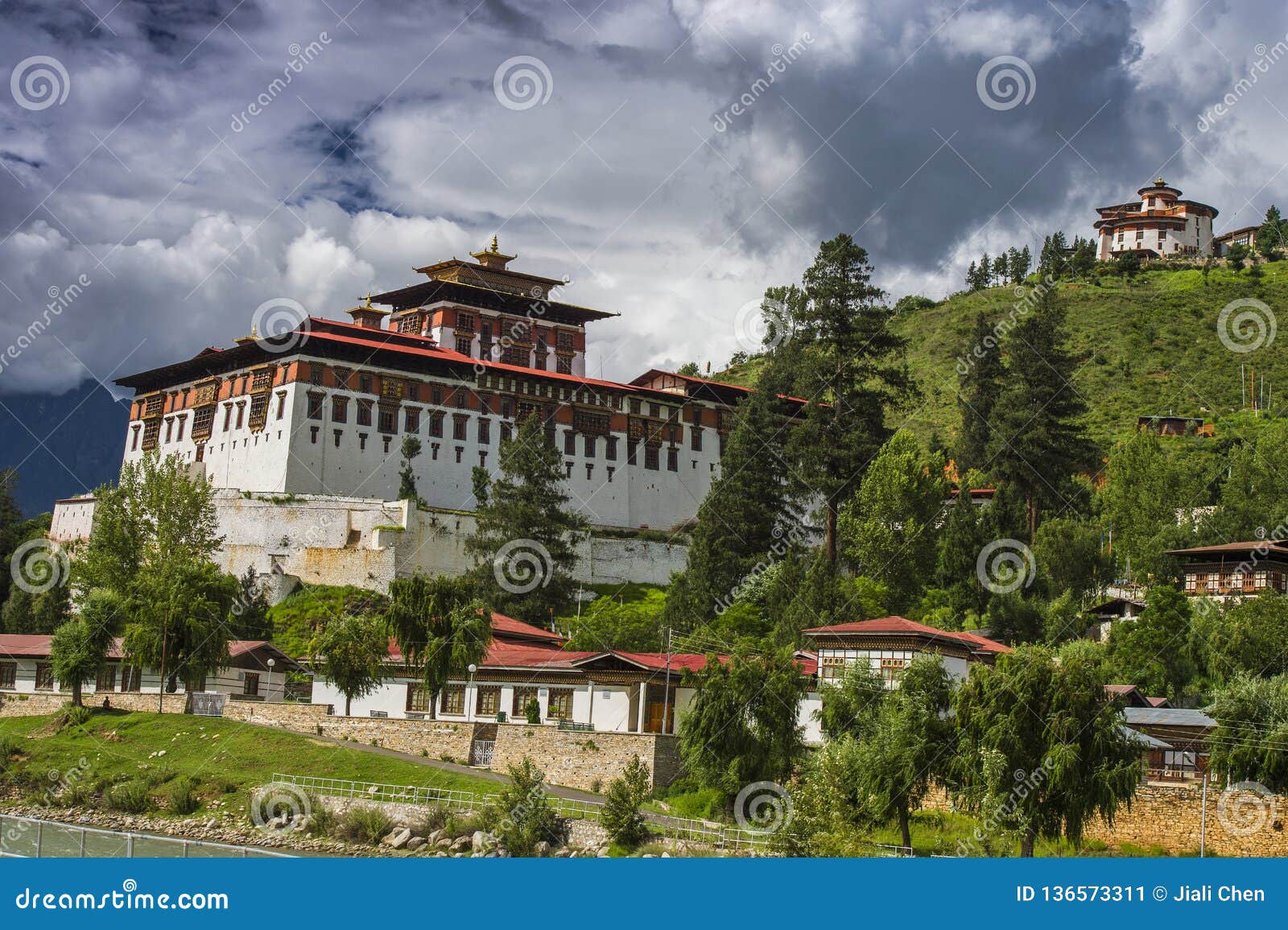paro dzong and ta dzong with floating clouds , paro , bhutan