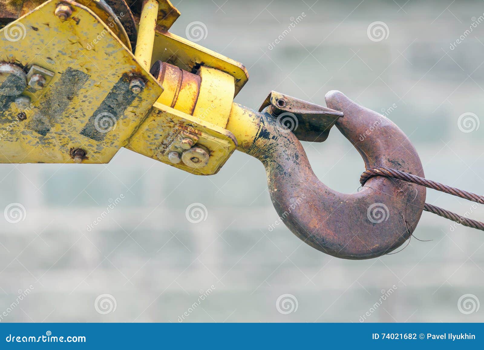 Part of crane on exhibition background of heavy industrial machinery. Part of crane on the exhibition background of heavy industrial machinery. It may be a business concept and idea of reliability, strength and power