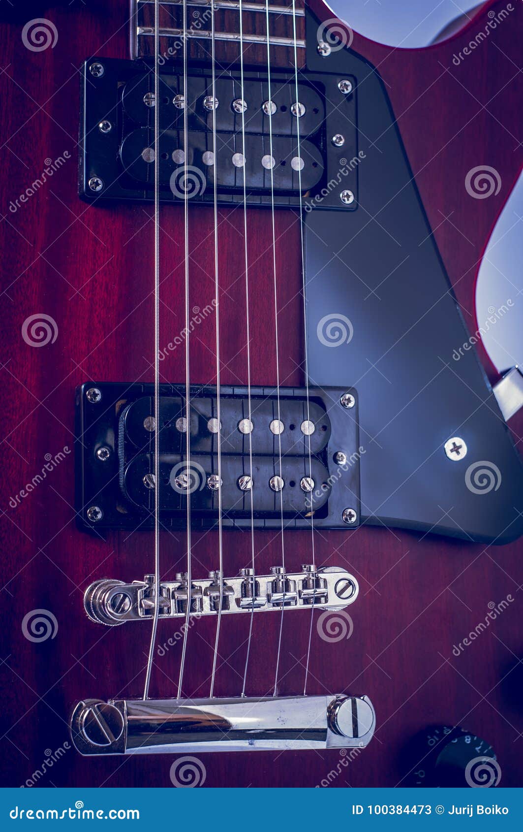 Part Of Electric Guitar On Black Background. Metal Strings. Neck Of