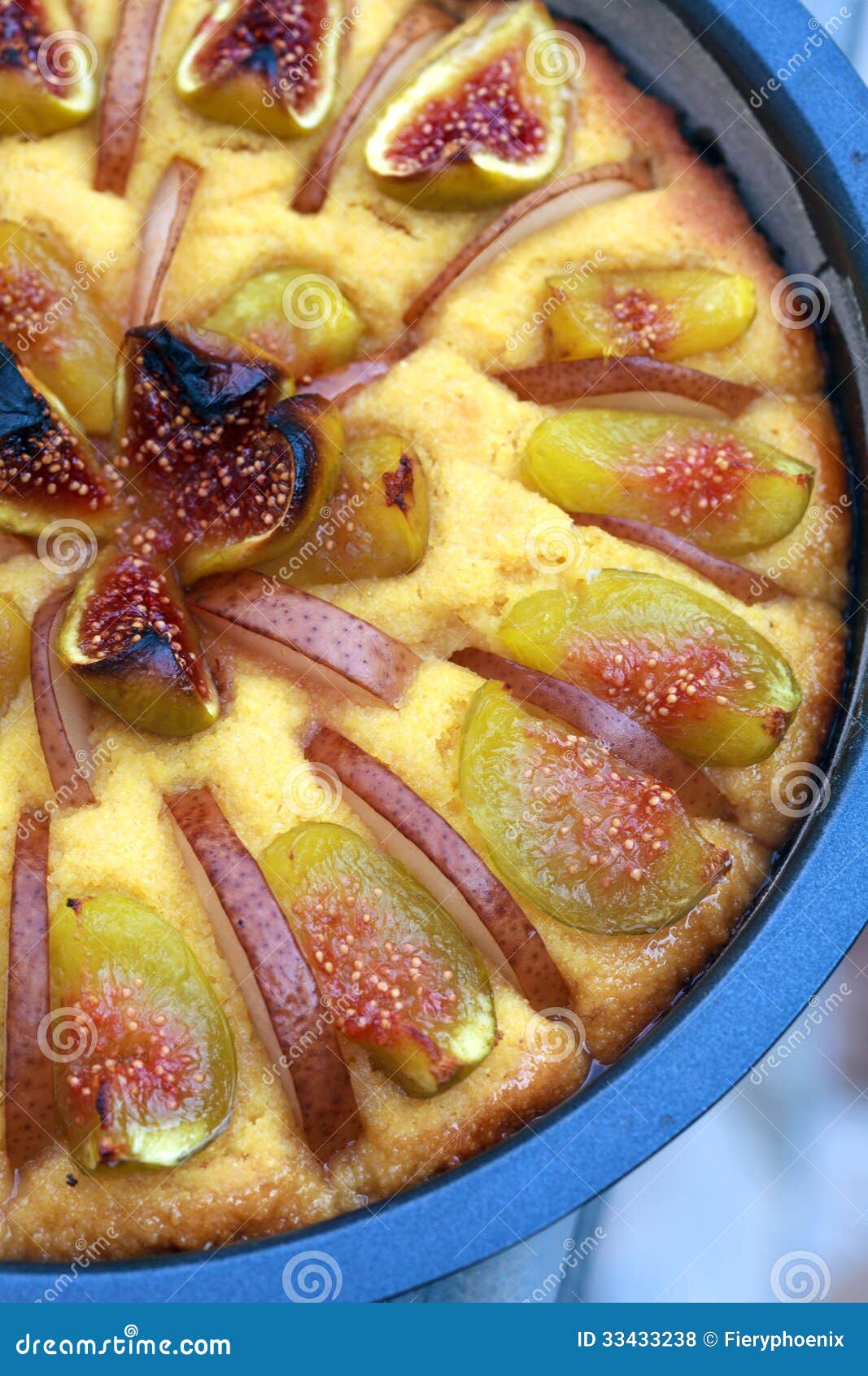 part of tart with caramelised figs and pears with corn meal close-up