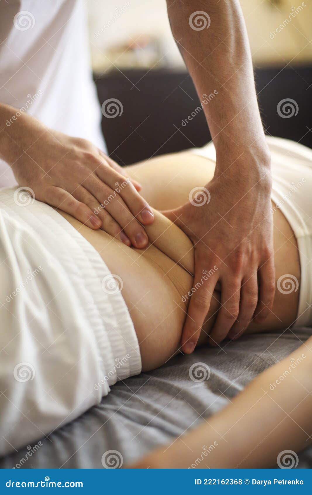 young woman having stomach massage
