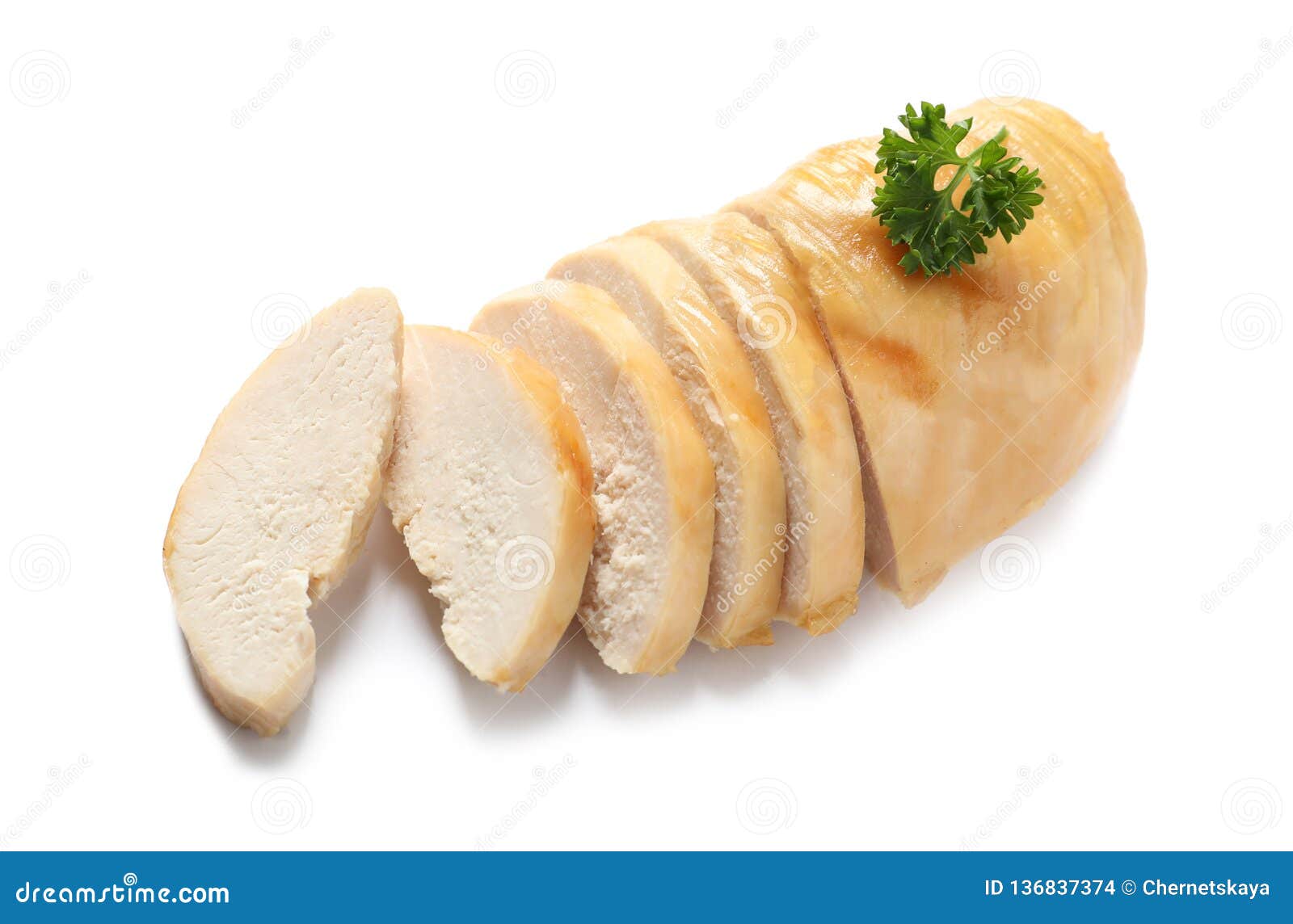 Partially Cut Fried Chicken Breast with Parsley Isolated on White Stock