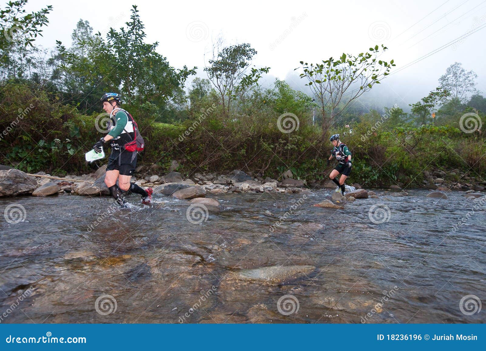 Participants Wading through River in Race Editorial Photo Image of