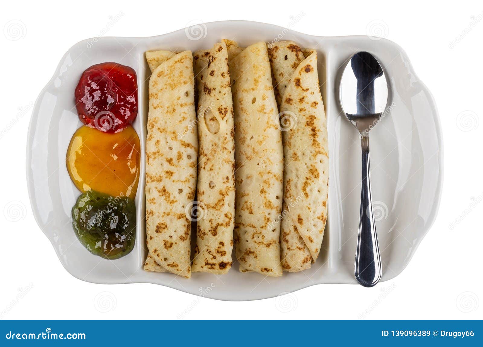 partitioned dish with jams, pancake rolls, spoon  on white. top view
