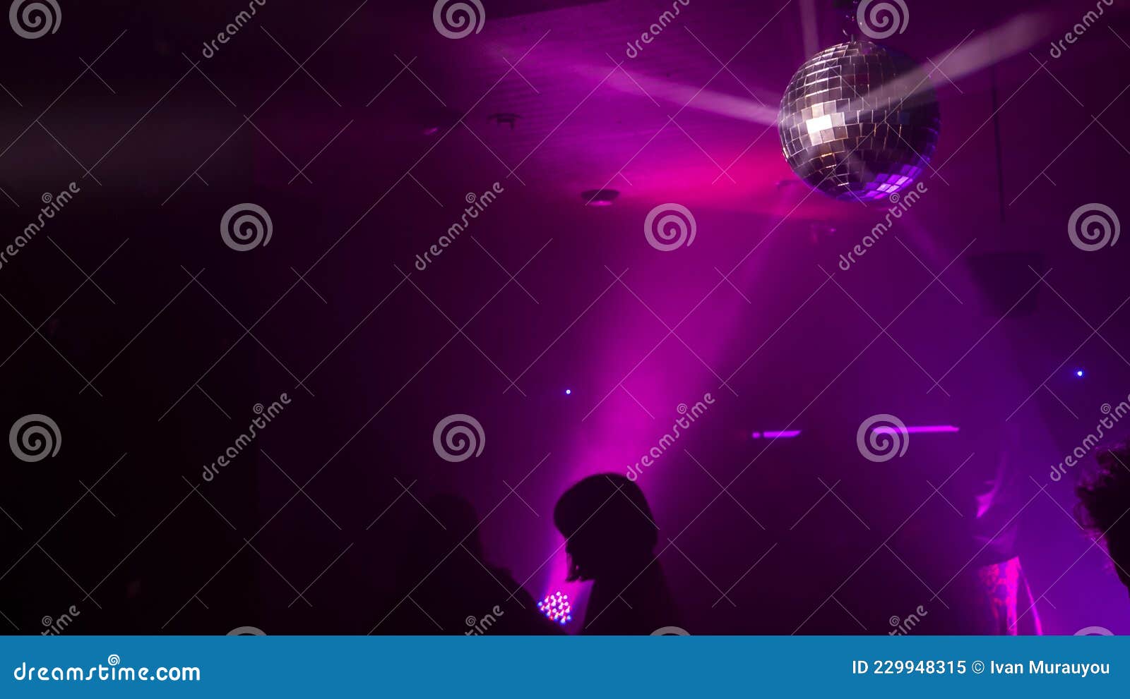 Party Atmosphere with Disco Ball. Light Beams Reflecting from a Disco ...