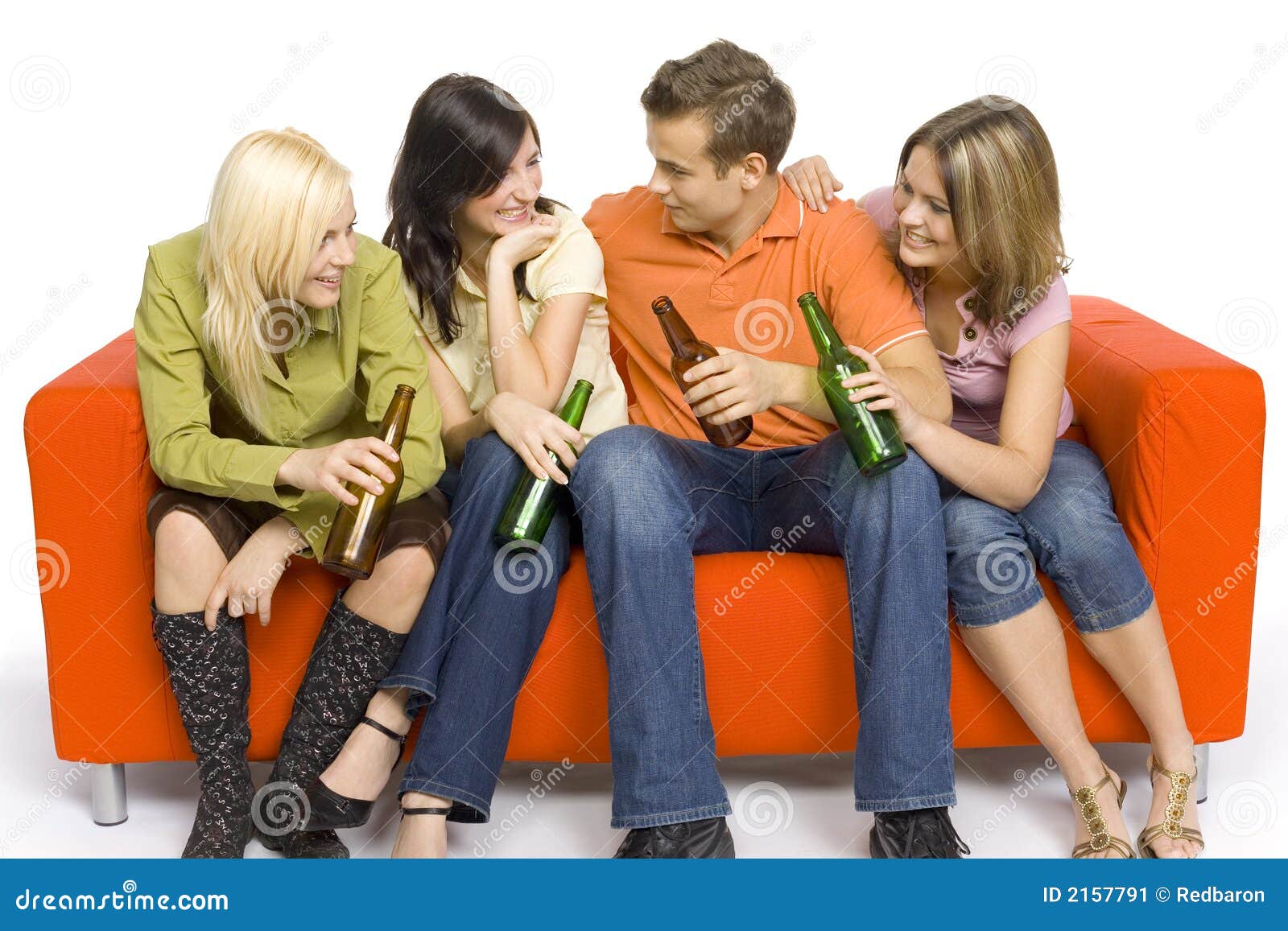 Party on the orange couch stock image. Image of culture 2157791