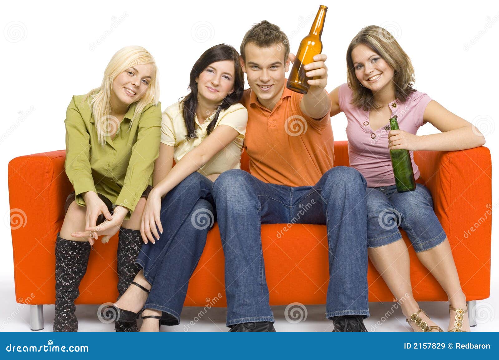 Party on the orange couch stock image. Image of leisure 2157829