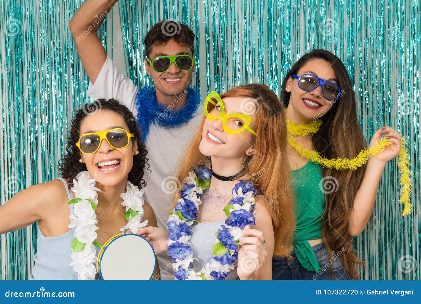 partygoers are celebrating carnival in brazil. people in colorful and happy sunglasses..