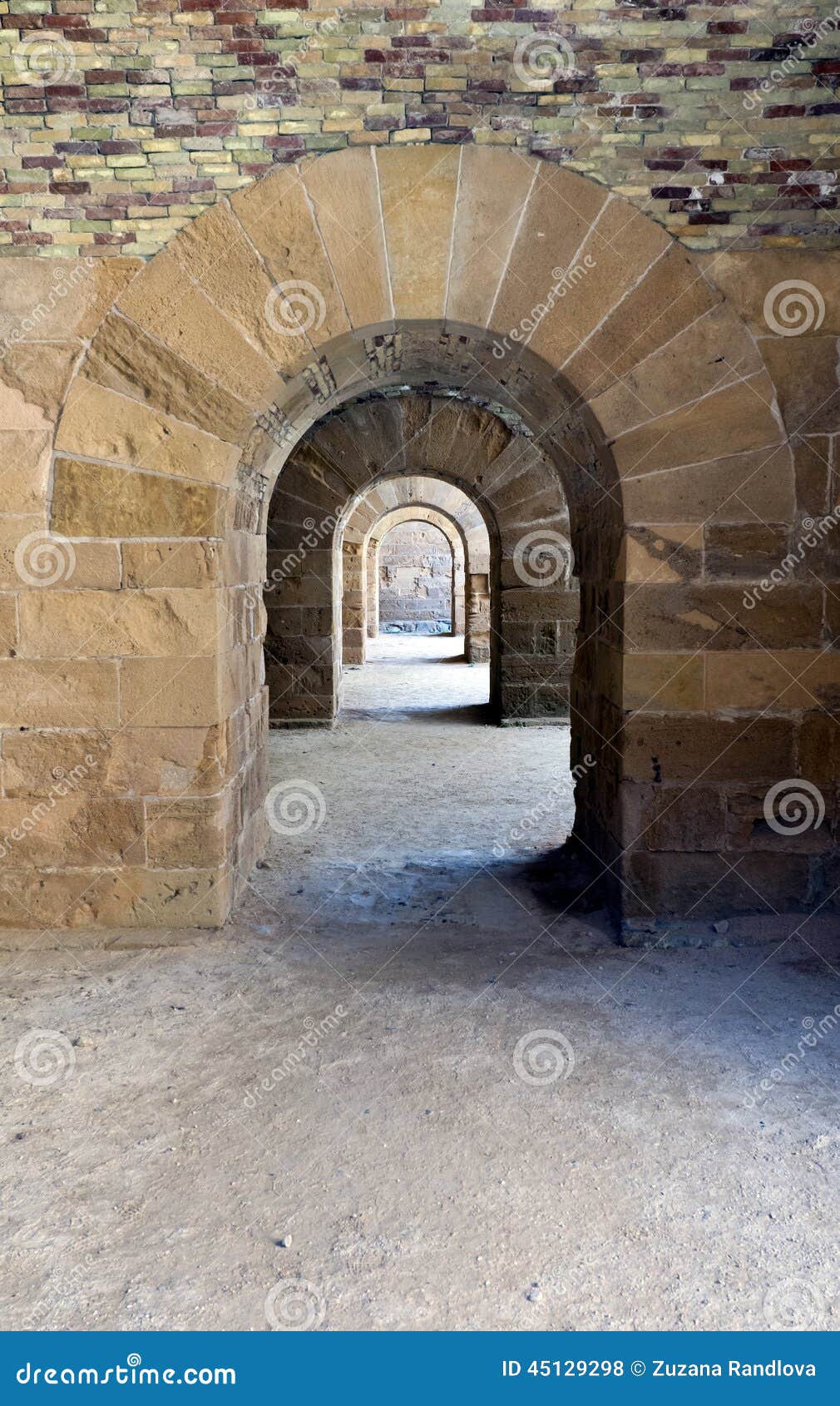 a passageway with round arches