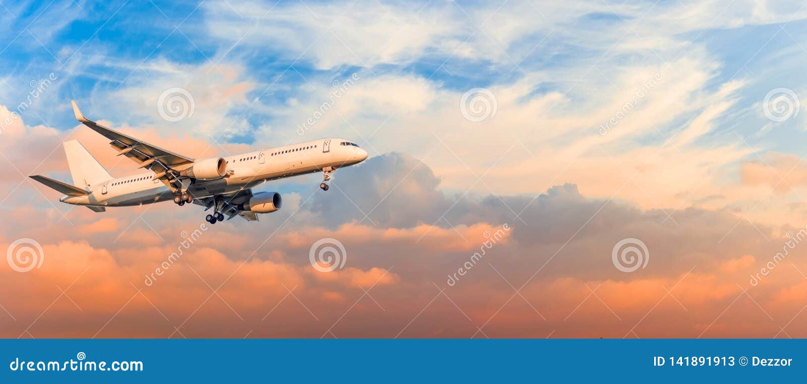 passenger airplane is landing approach gear released, against sunset sky clouds, panorama. travel aviation, flight, trip