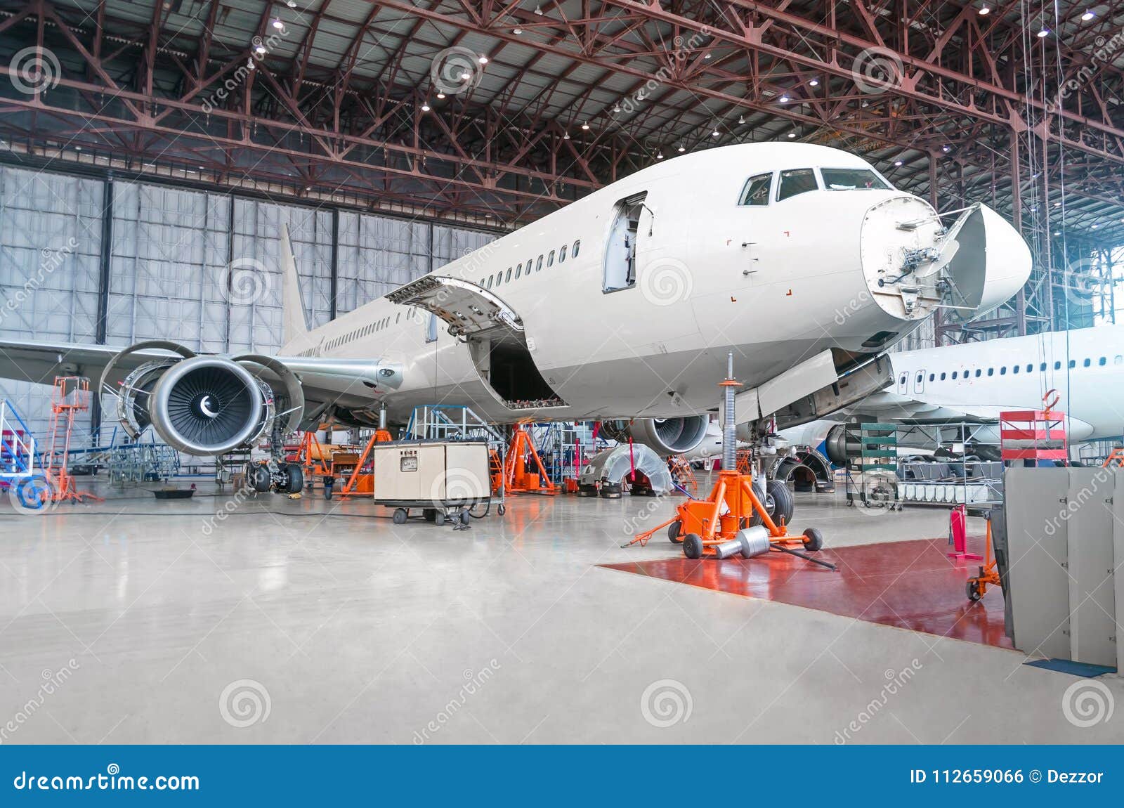 passenger airplane on maintenance of engine and fuselage repair