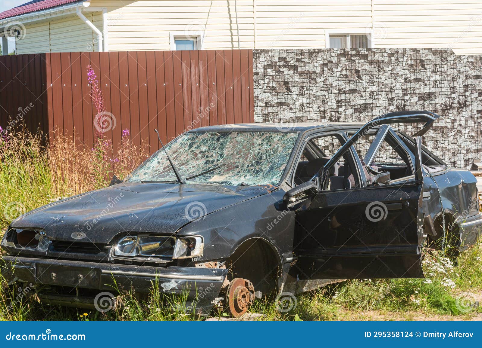 A Passenger Car after an Accident with a Broken Windshield and Crumpled