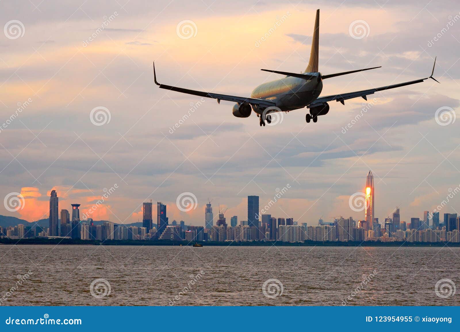 passenger jet airliner plane arriving or departing shenzhen, china
