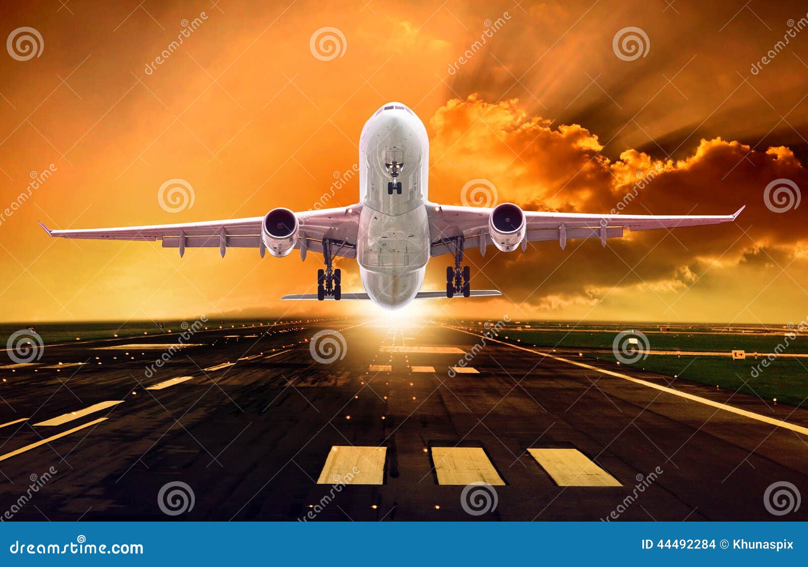passenger plane take off from runways against beautiful dusky sk