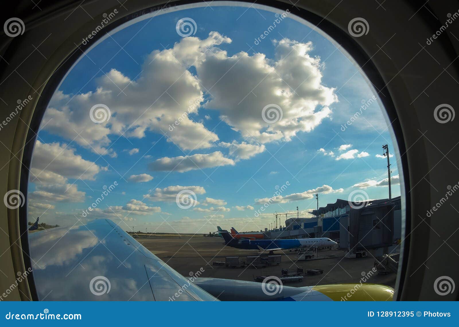 passenger planes at the airport, view through window