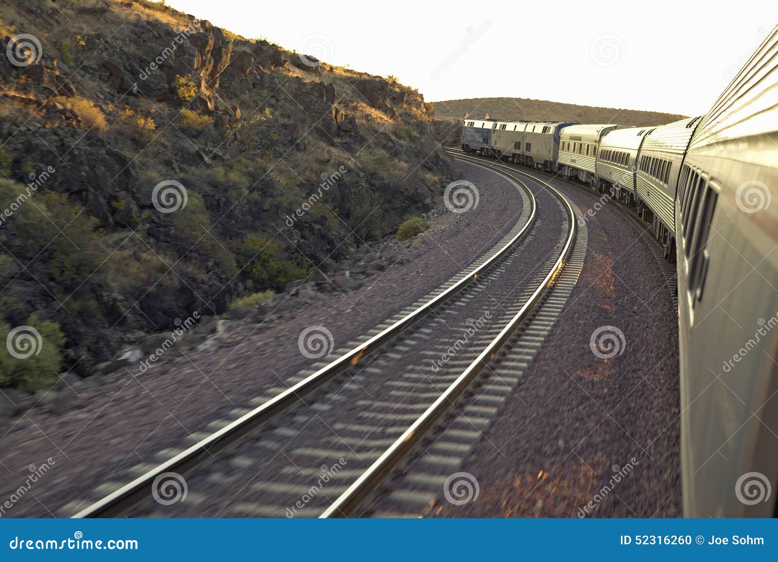 Passenger Train Traveling into the Arizona Sunset Stock Photo Image