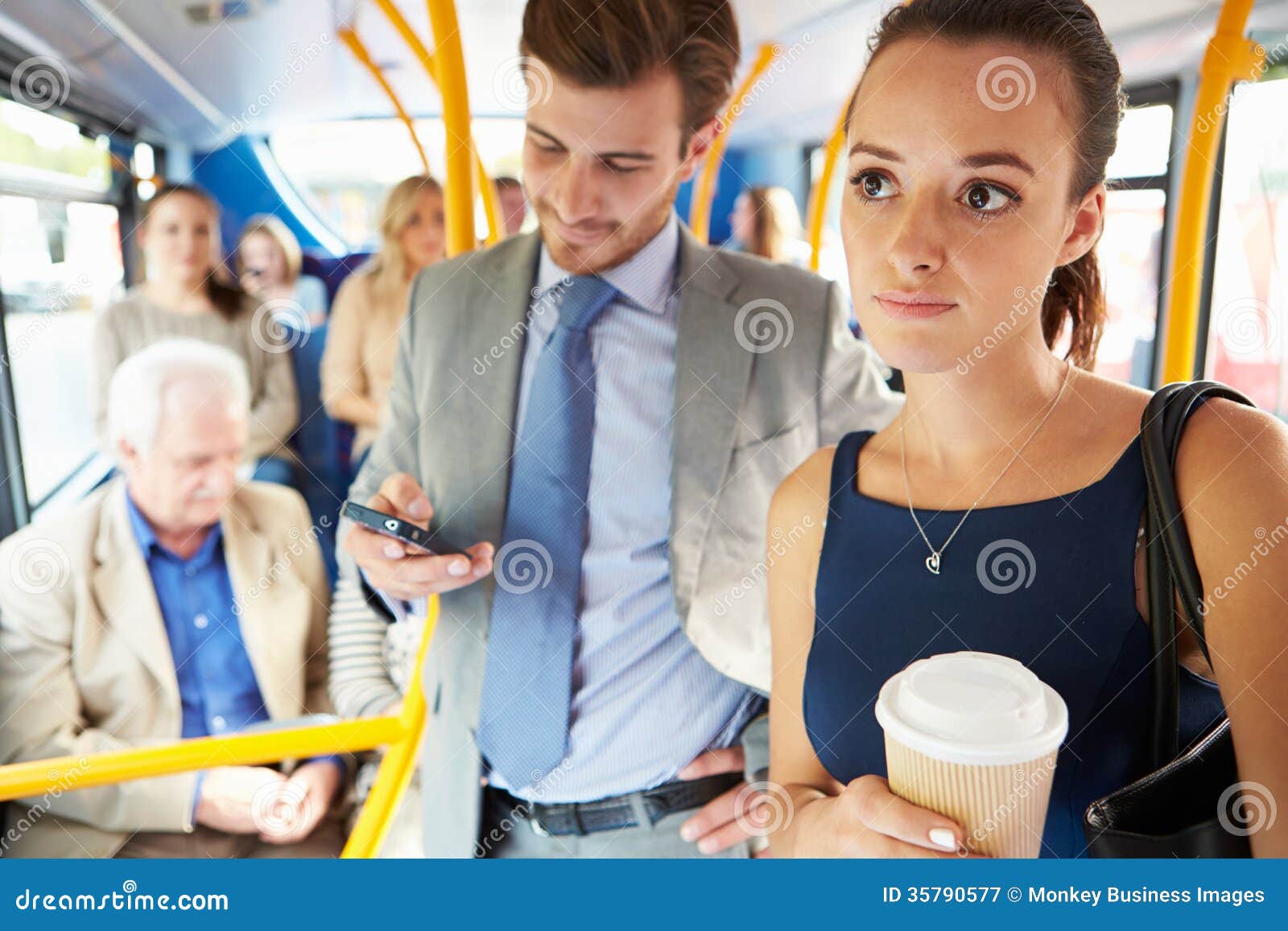 passengers standing on busy commuter bus