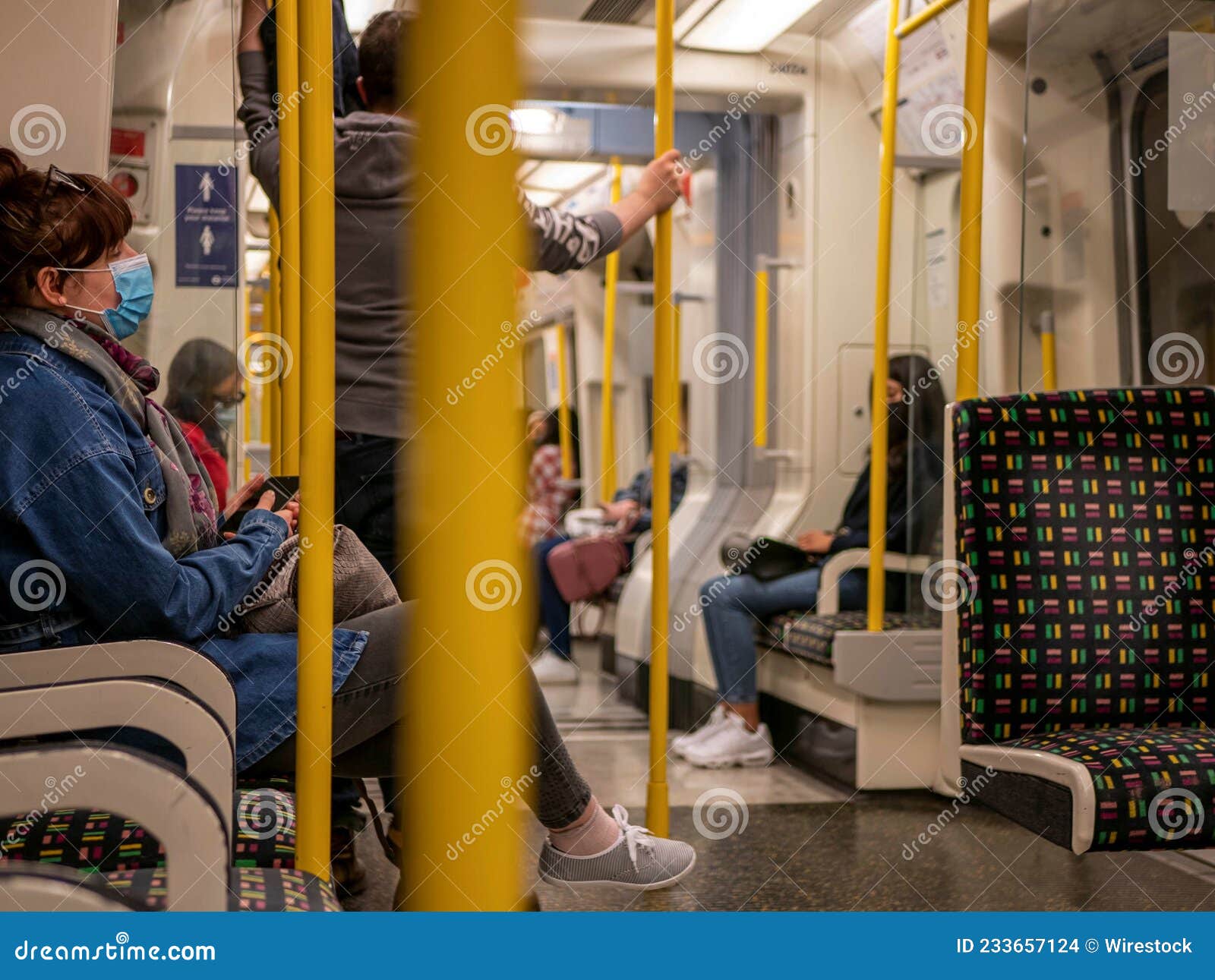 Passengers in a Train with Masks during a Covid Pandemic Editorial