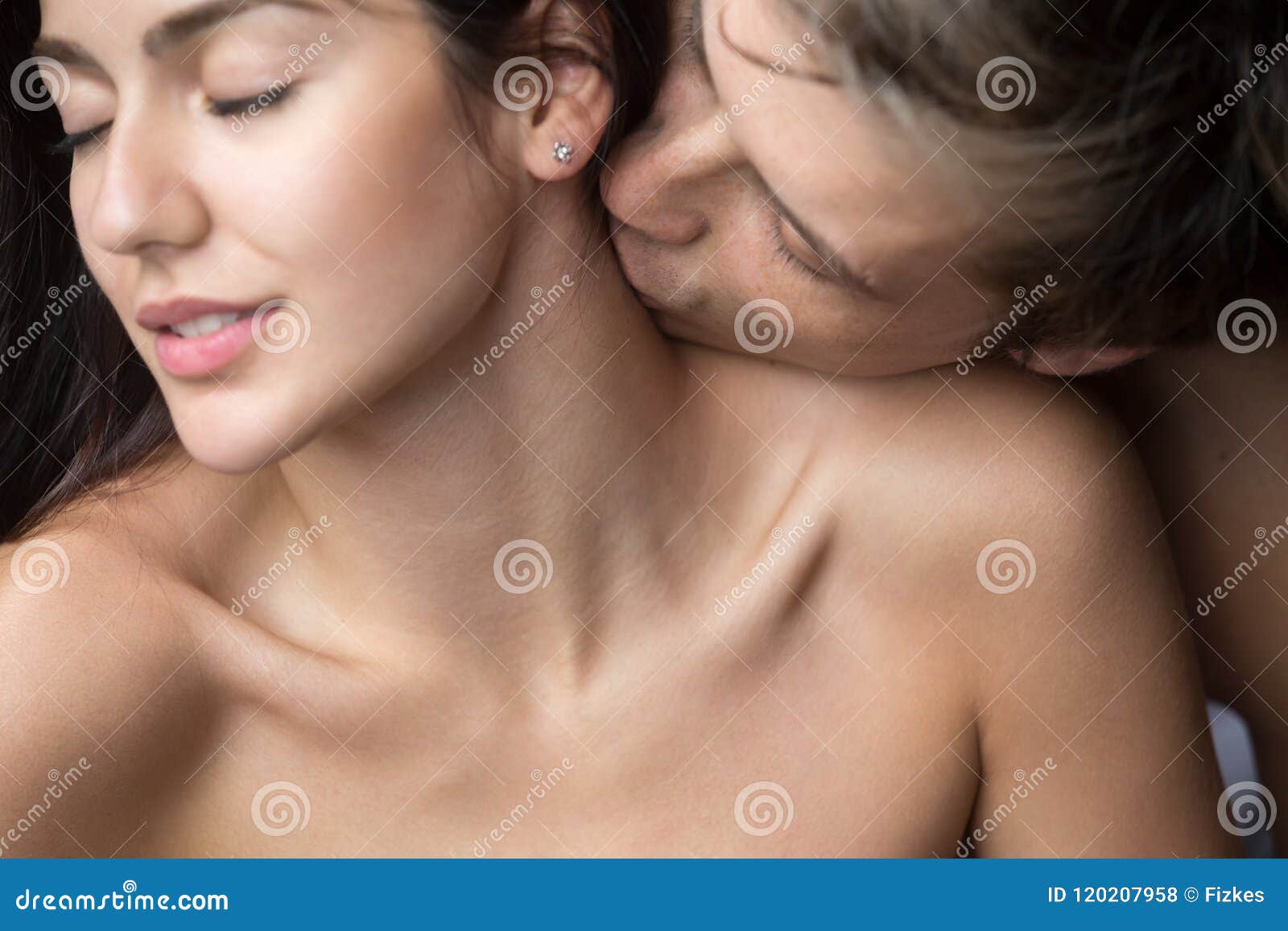 Passionate Man Kissing Woman on Neck Enjoying Foreplay Stock Photo picture