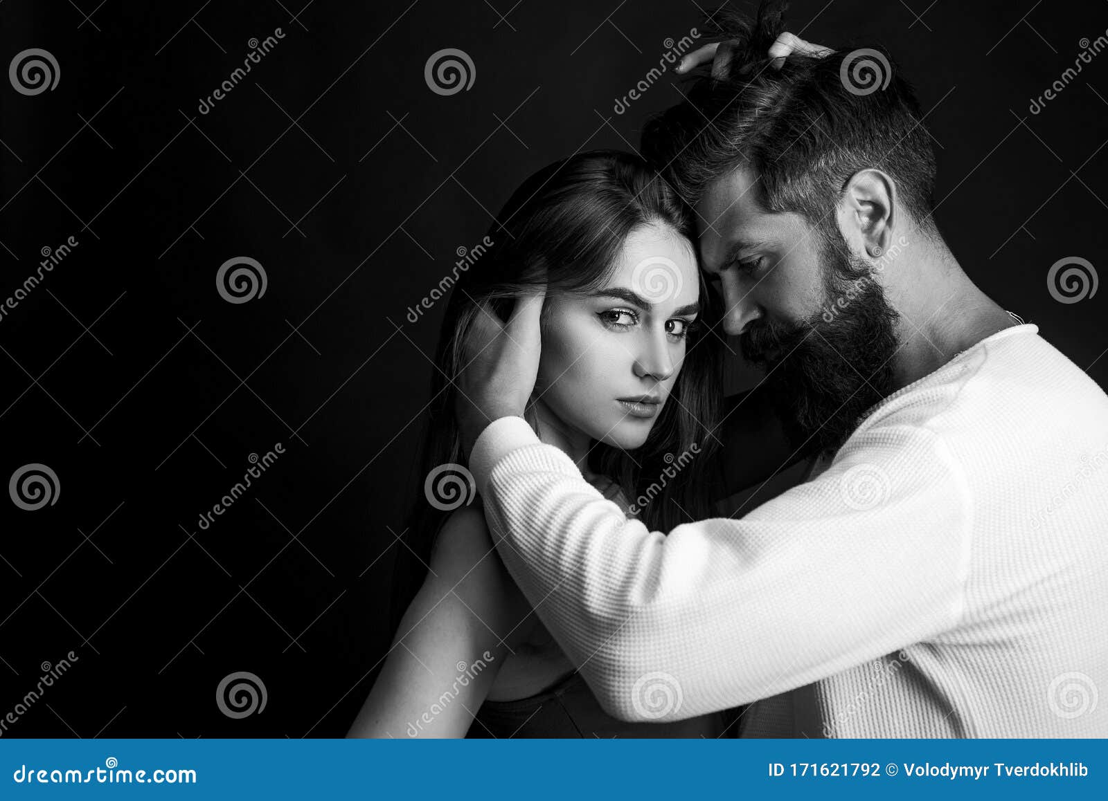 Passionate Man Gently Kissing Beautiful Woman with Desire