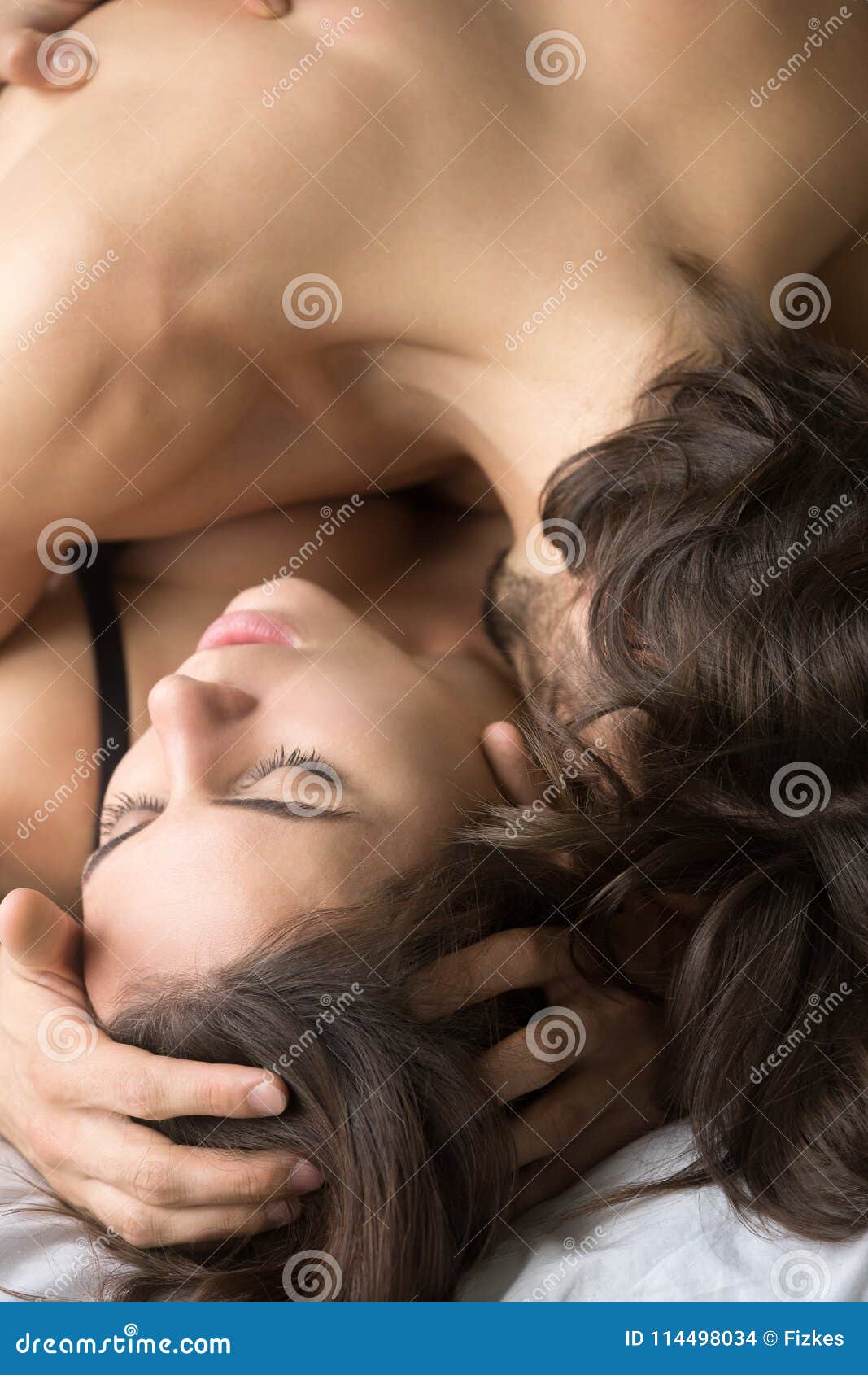 Passionate Man Kissing Beautiful Woman on Neck Having Sex, Verti Stock Photo