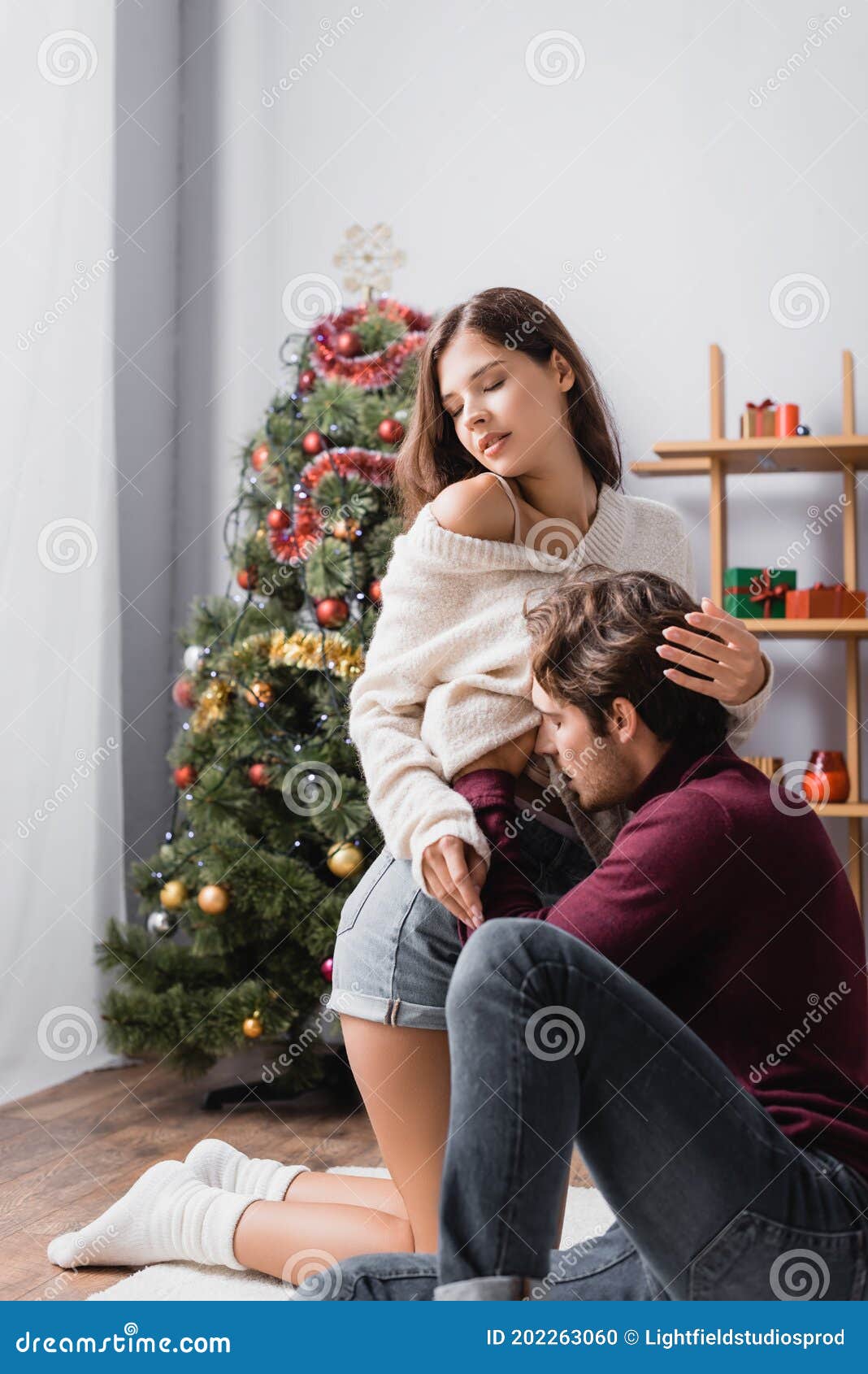Man Undressing Woman in Sweater Near Stock Photo Image of boyfriend