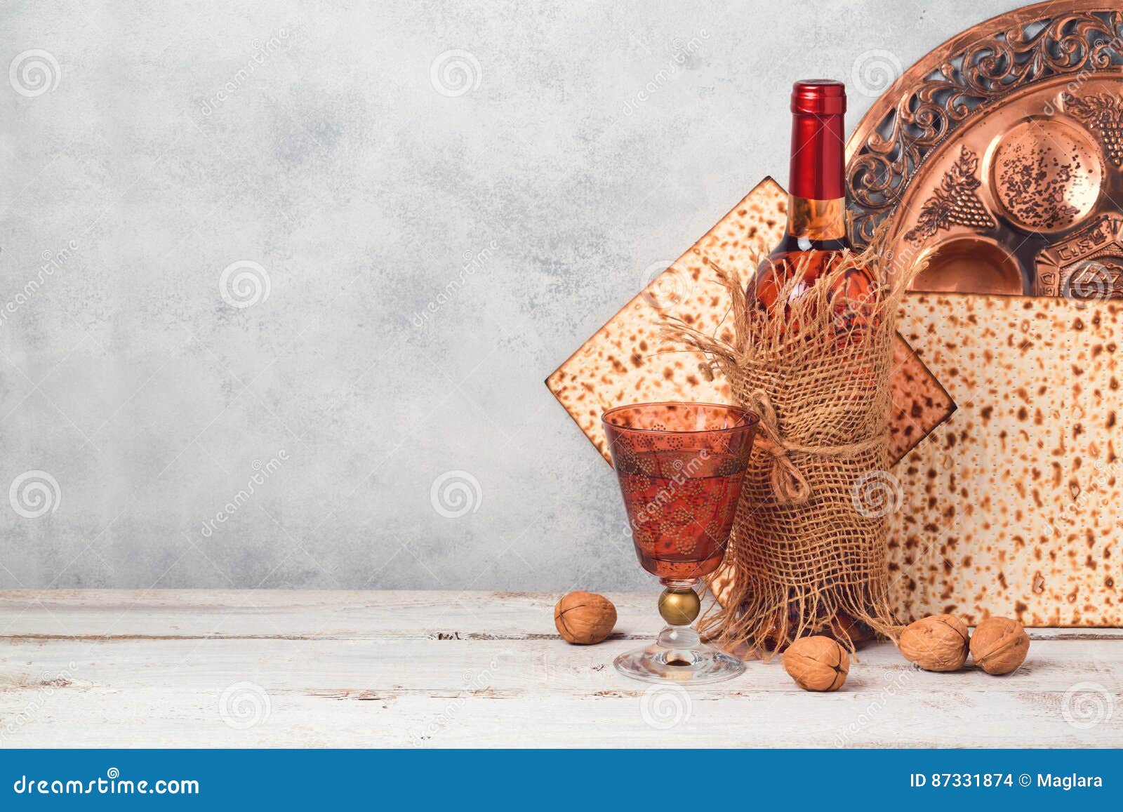 passover holiday concept with wine and matzoh over rustic background